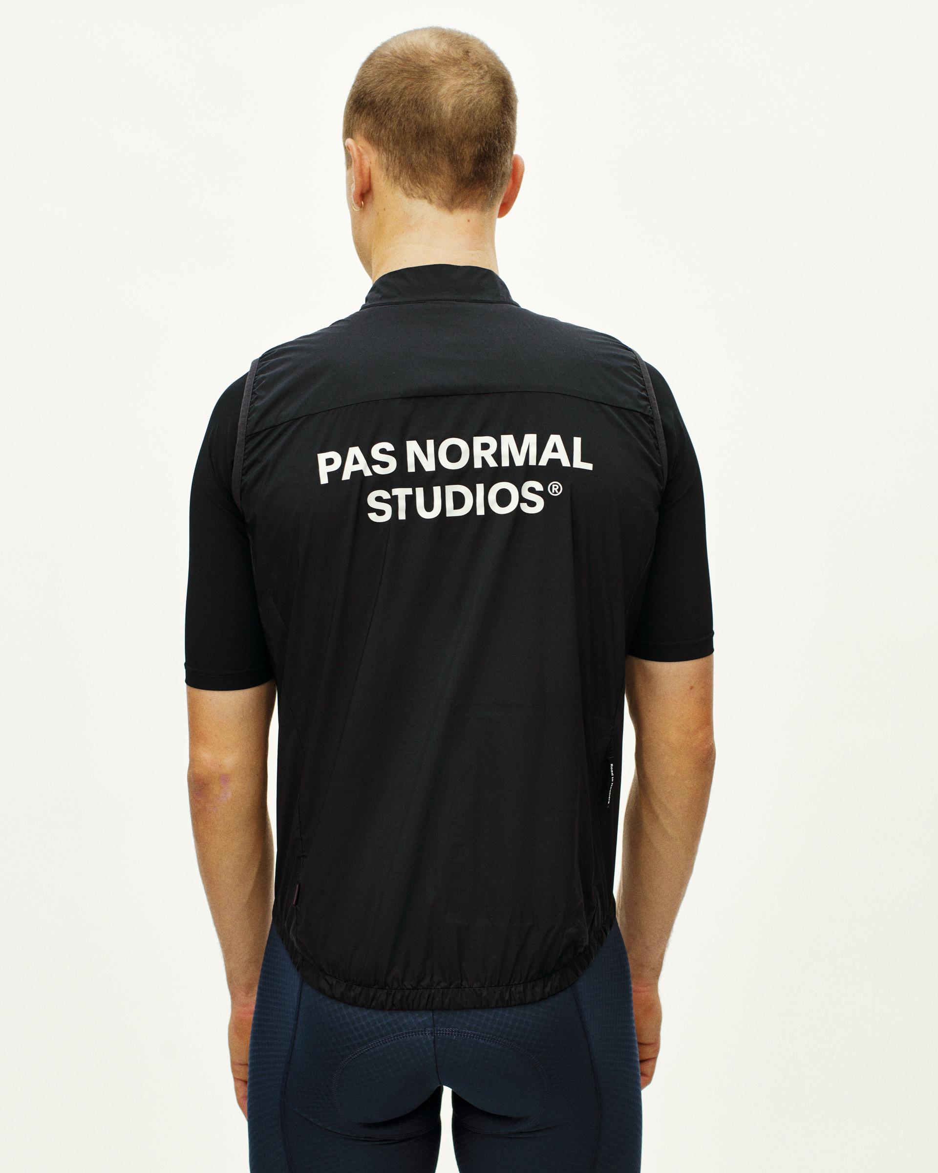 Black Essential insulated gilet, rear view on model with white back print