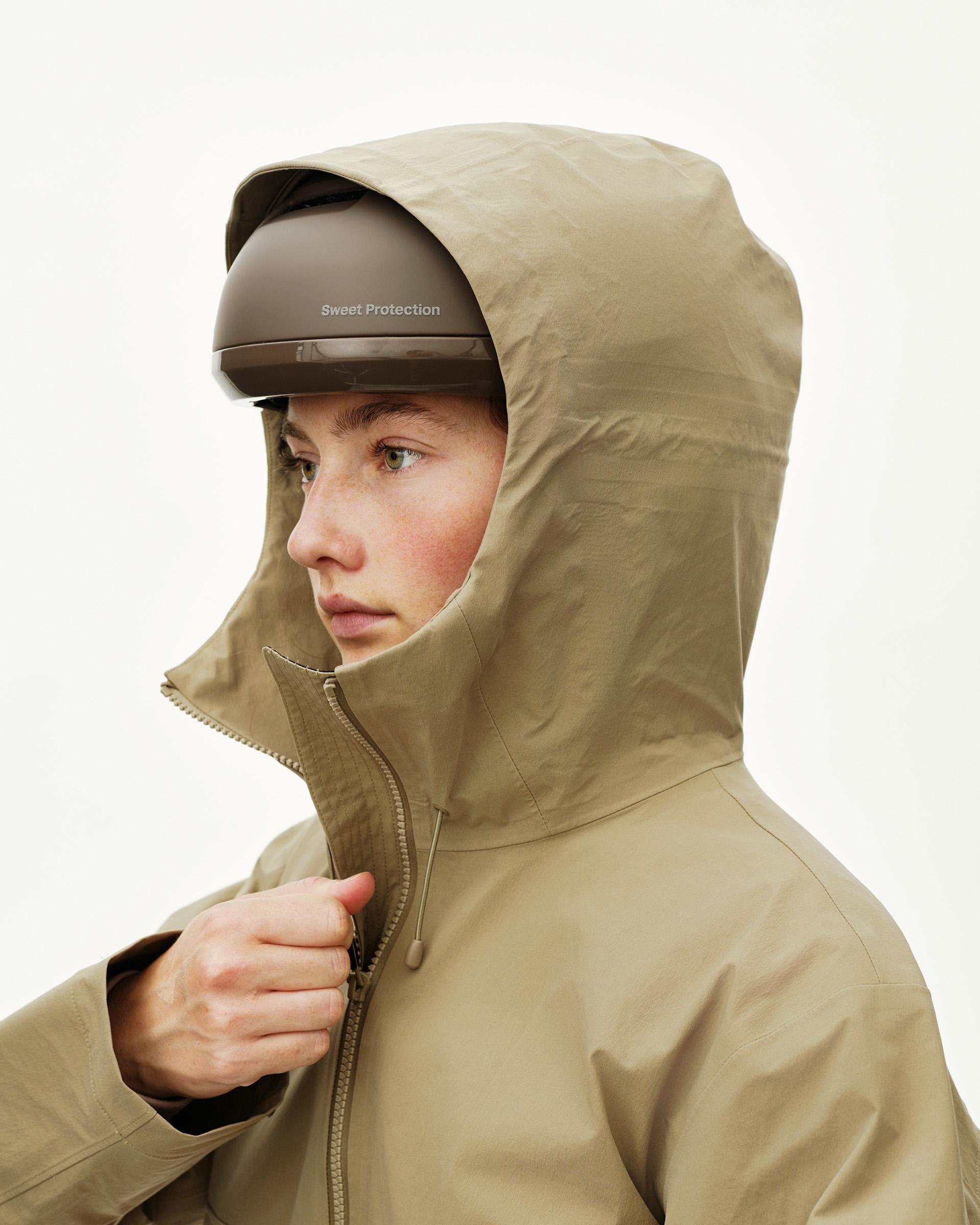 Dusty Earth khaki Off-Race 3L Shell jacket on model, side detail view with helmet-compatible storm hood and front zip