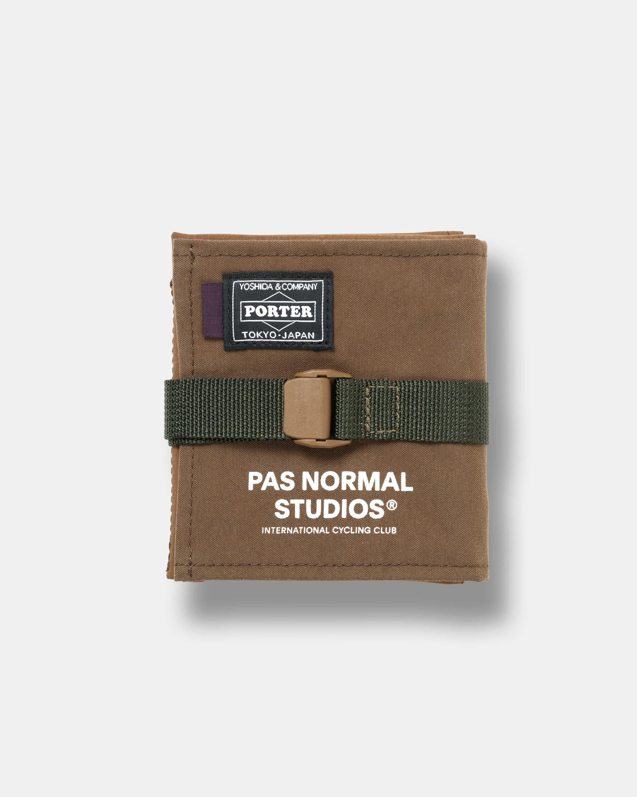 Light Brown Porter-Yoshida cycling saddle bag, front flat lay with green strap buckle closure