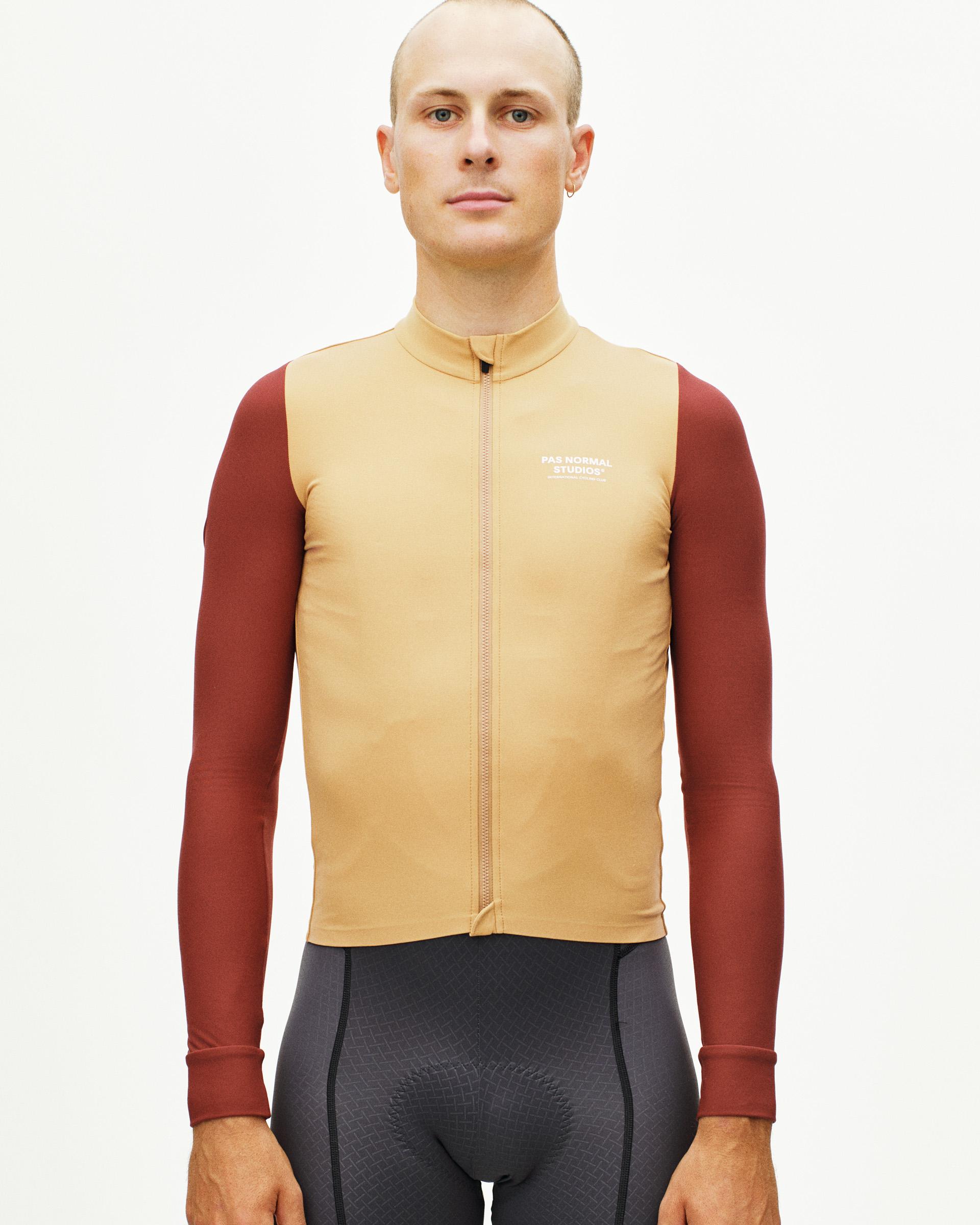 Camel Mechanism long sleeve cycling jersey on model with maroon sleeves and full zip