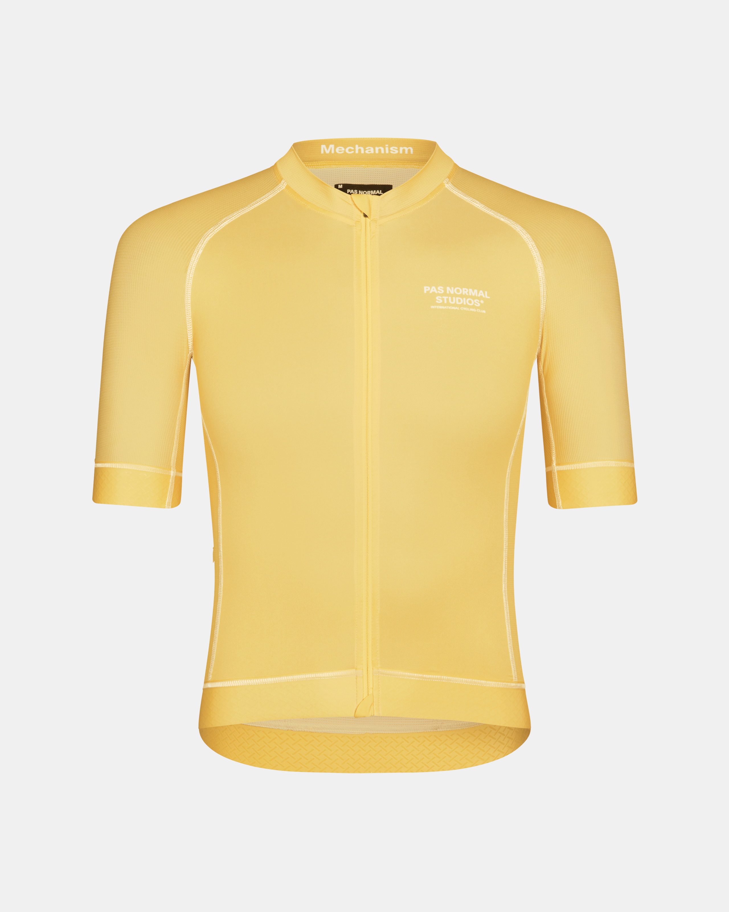 Yellow Mechanism cycling jersey, front flat lay with white contrast stitching