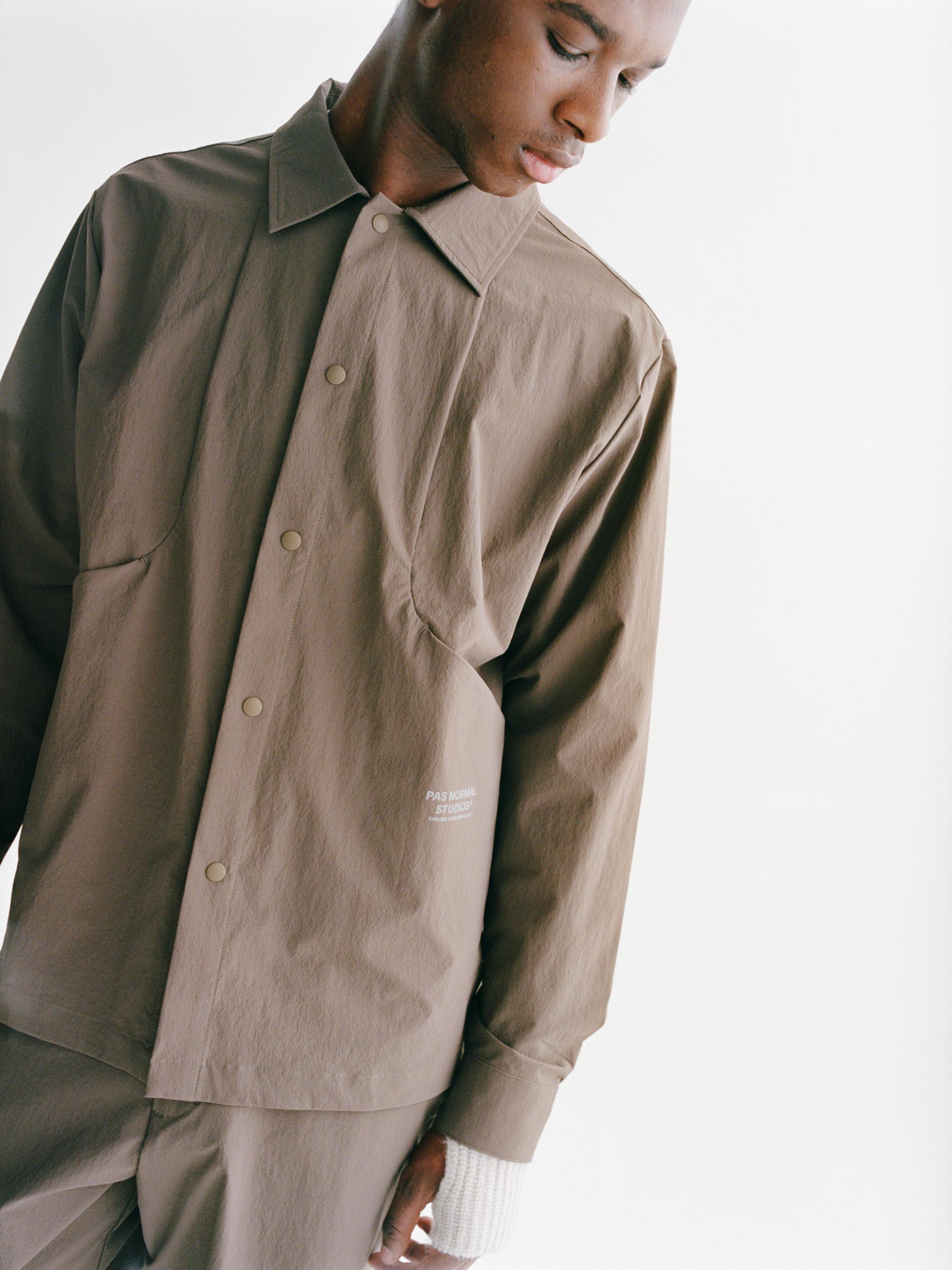 Ash Brown Off-Race Tech Overshirt on model with olive jacket layered over shoulder