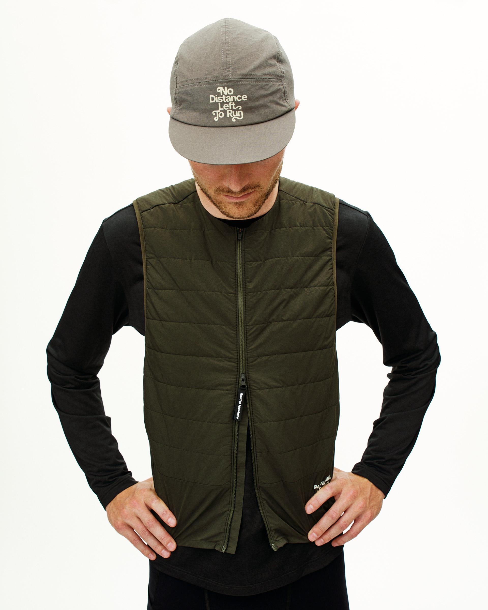 Dark Olive Balance Insulated vest on model, front view with quilted panels