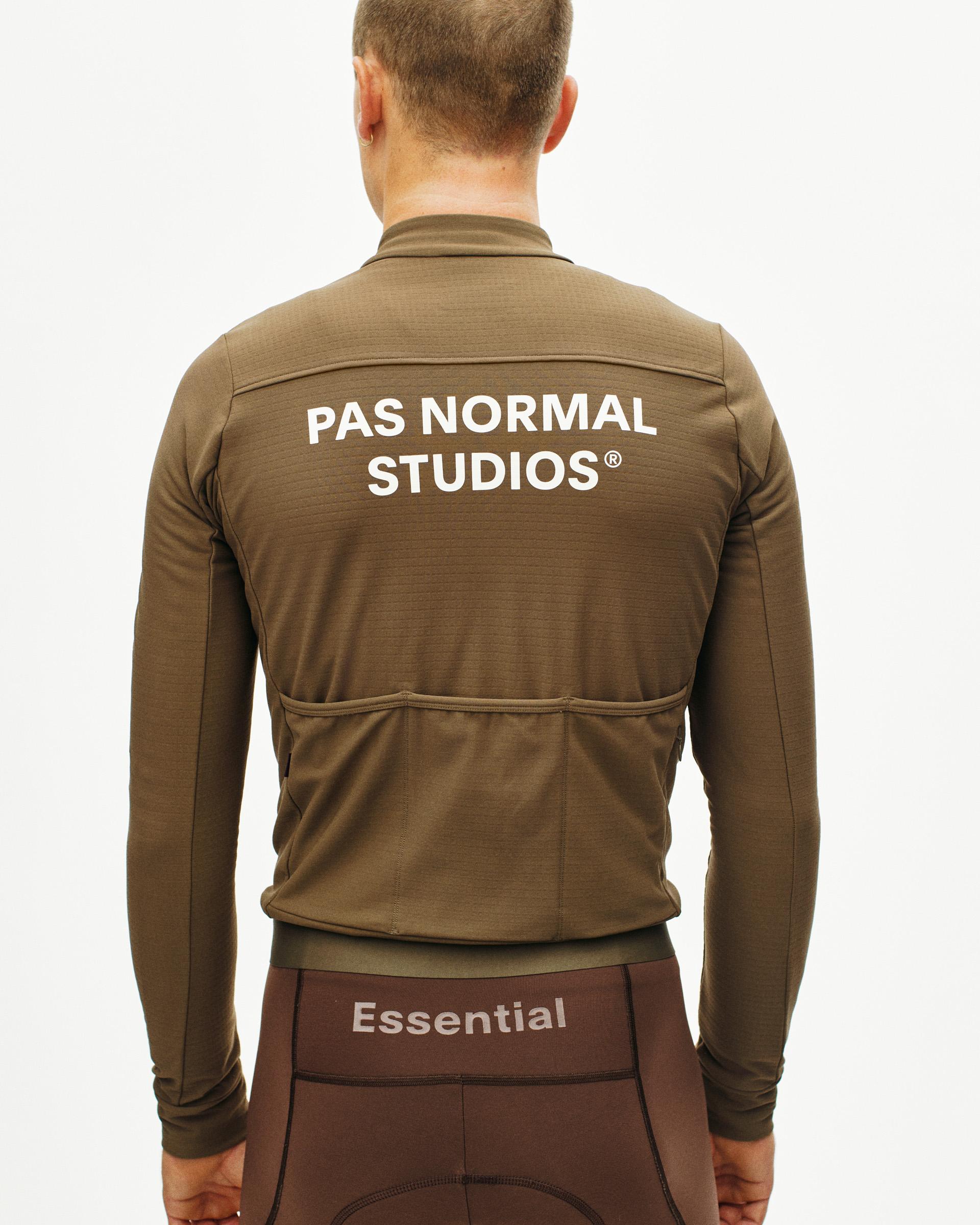 Brown Essential long sleeve cycling jersey, rear view on model with white back logo