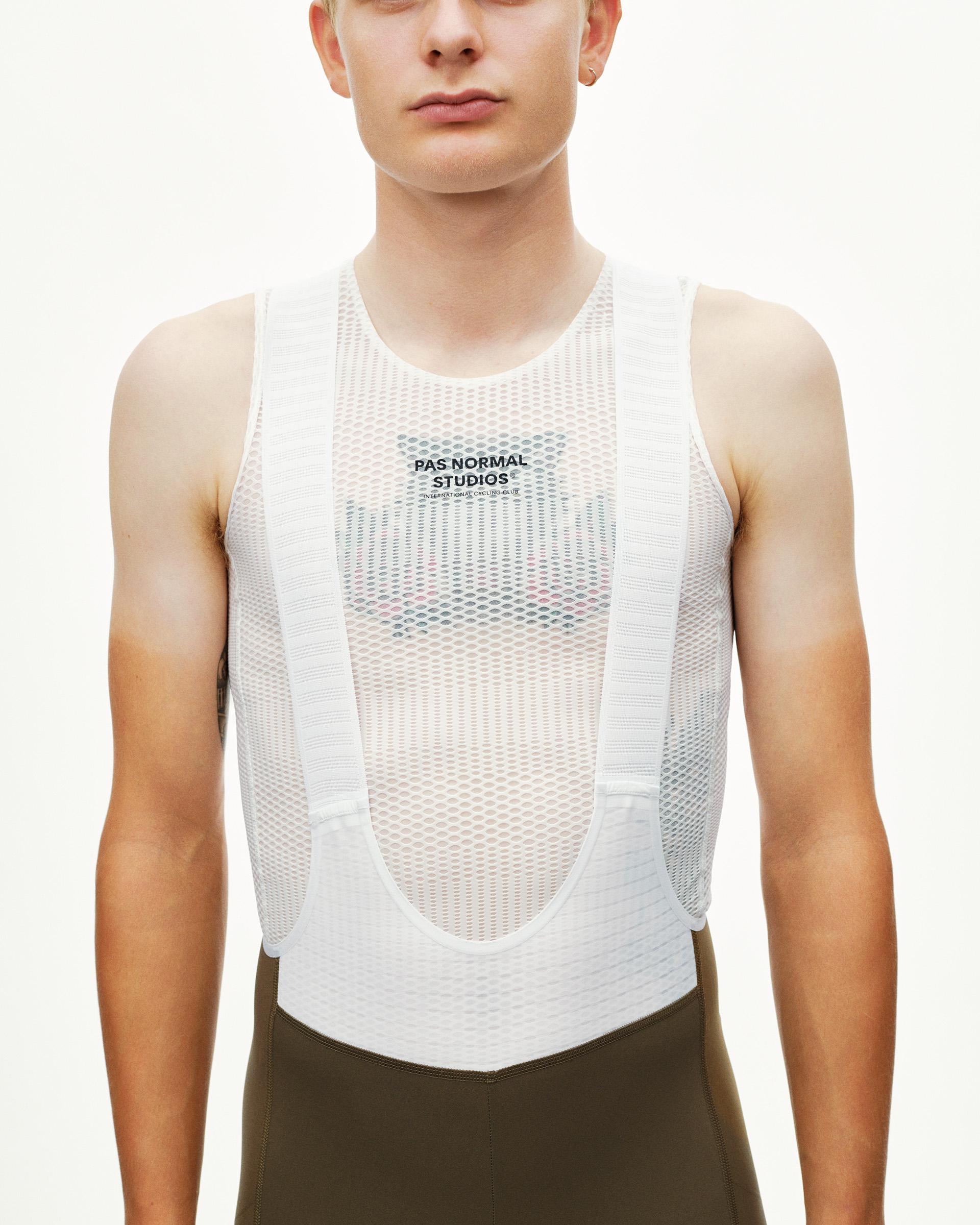 Dark Earth khaki PAS Mechanism Pro cycling bibs on model, front view with white mesh base layer