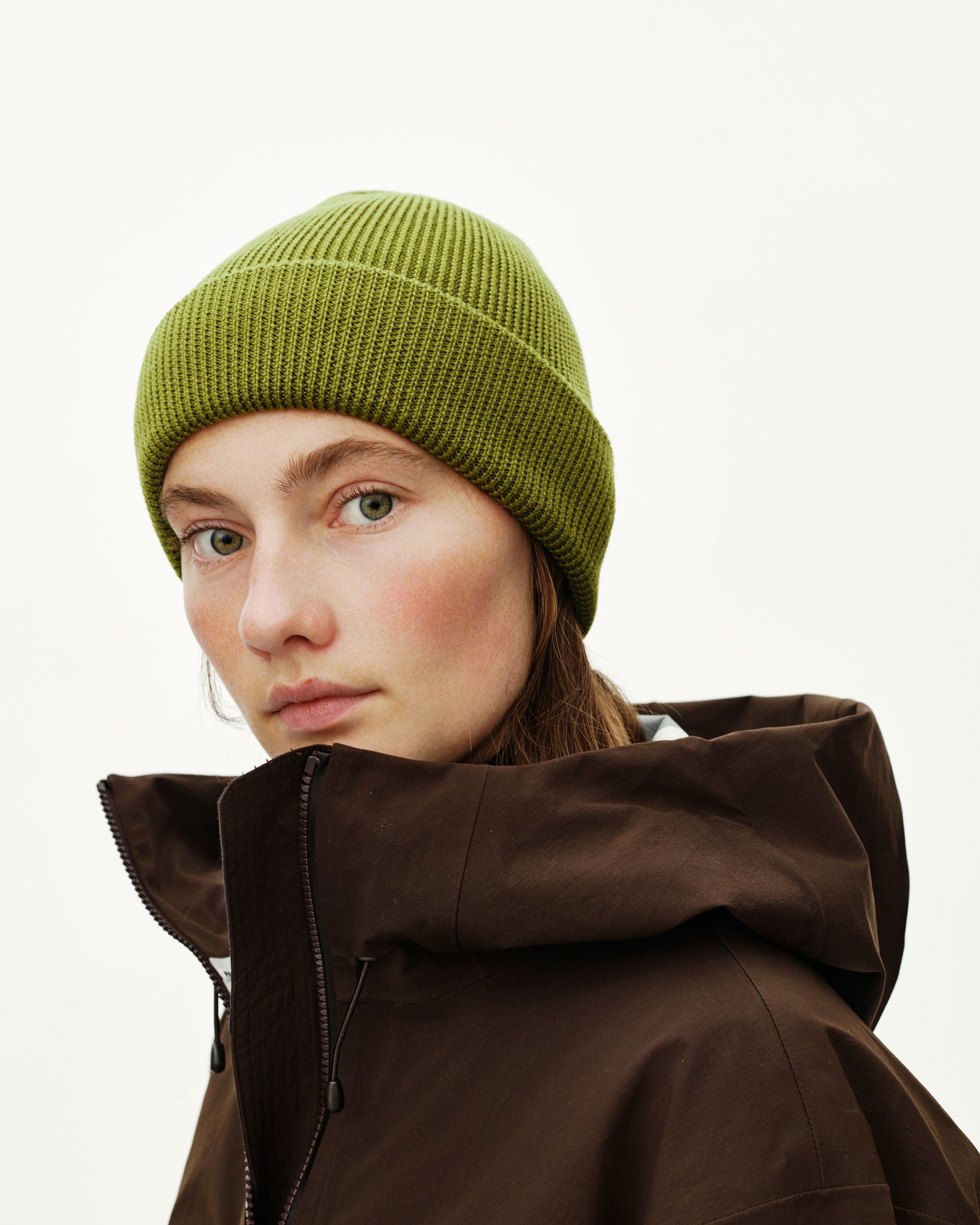 Dark Lime green Off-Race Wool Knit beanie on model, three-quarter front view with ribbed cuff