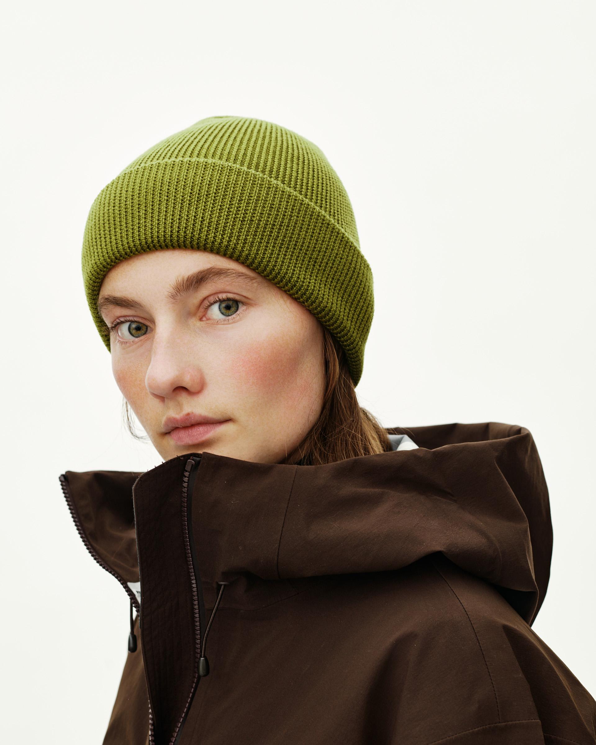 Dark Lime green Off-Race Wool Knit beanie on model, three-quarter front view with ribbed cuff