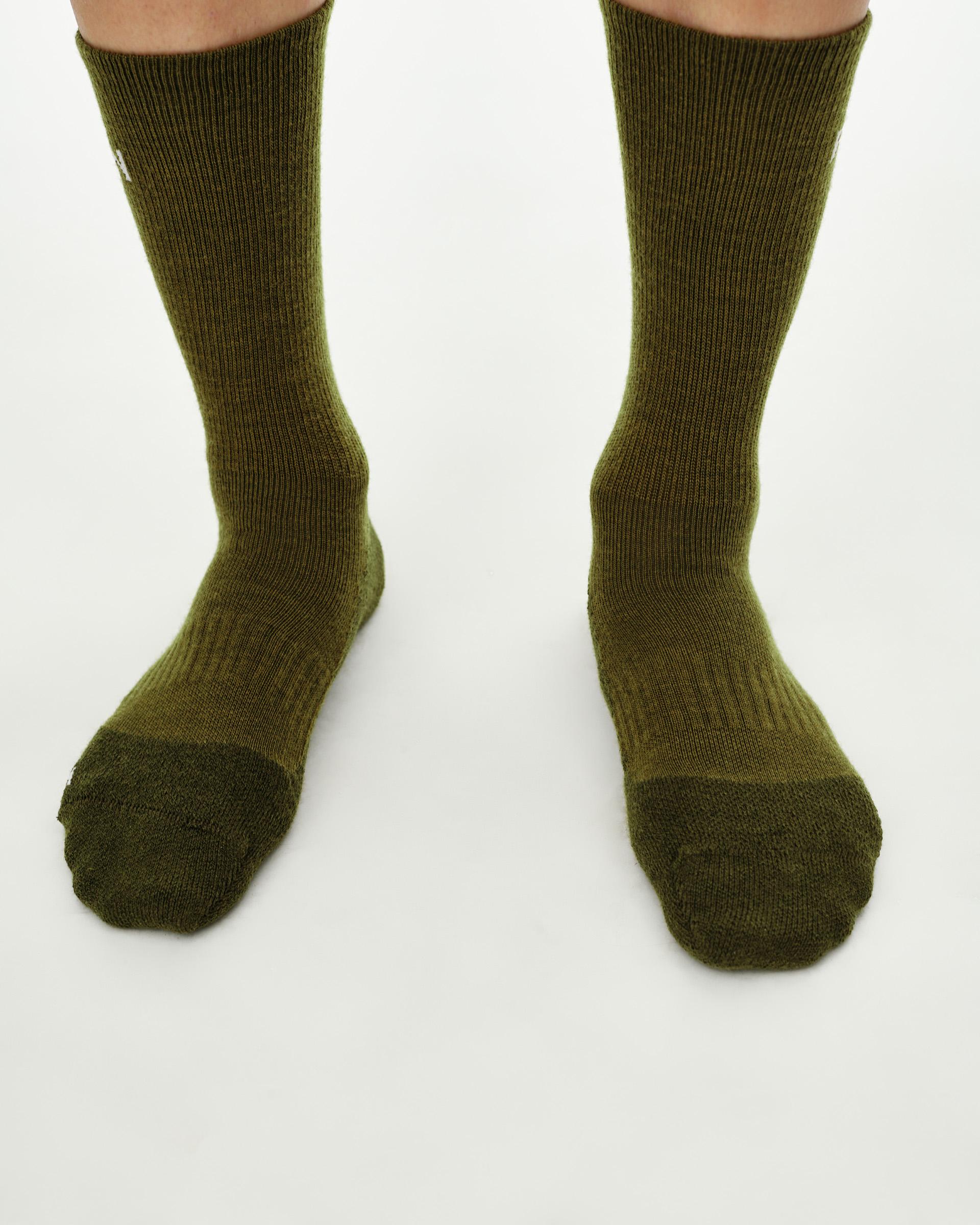 Khaki Green Deep Winter Wool cycling socks on model, front view with contrast toe box
