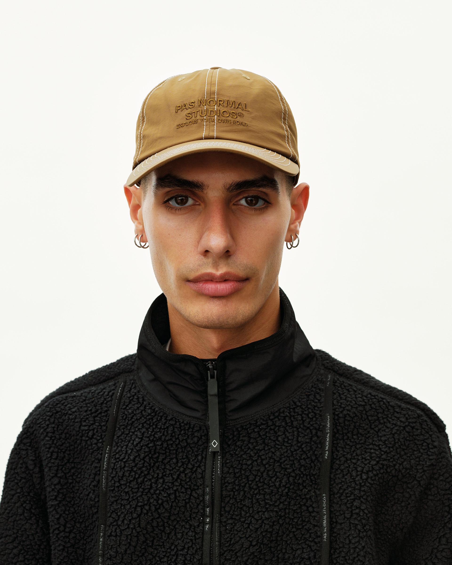 Wood brown Off-Race cap on model, front view with tonal embroidered logo and contrast stitching