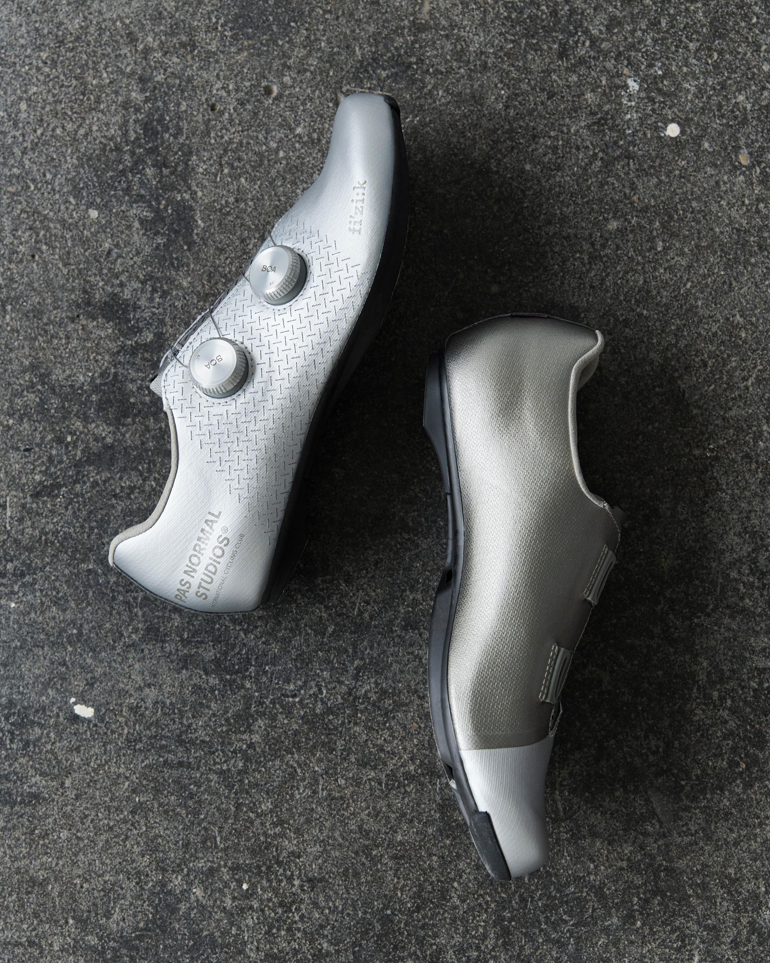 Silver Fizik Mechanism road cycling shoes, flat lay pair with dual BOA dials