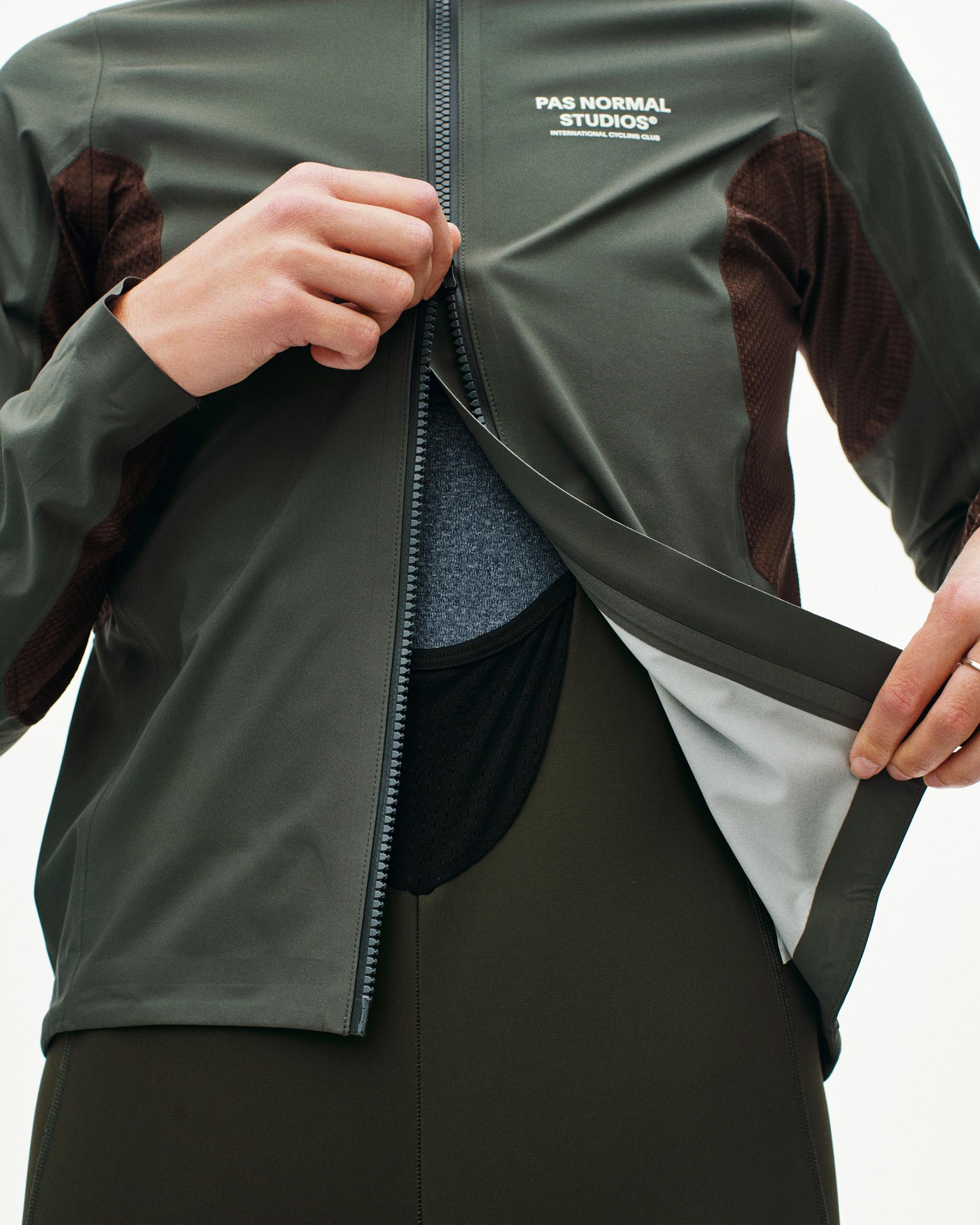 Dark Grey Mechanism Shell jacket on model with open front zip showing mesh panel interior