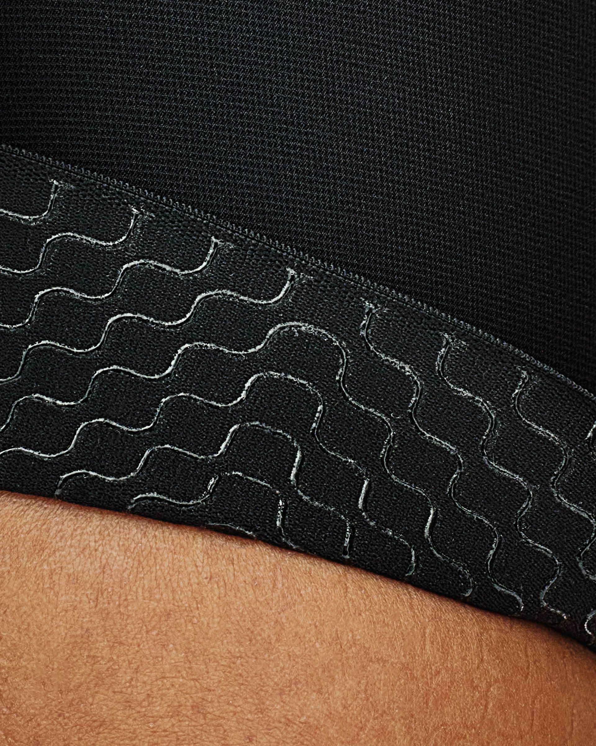 Light Olive Escapism Cargo cycling bibs detail view with white contrast stitching on textured fabric