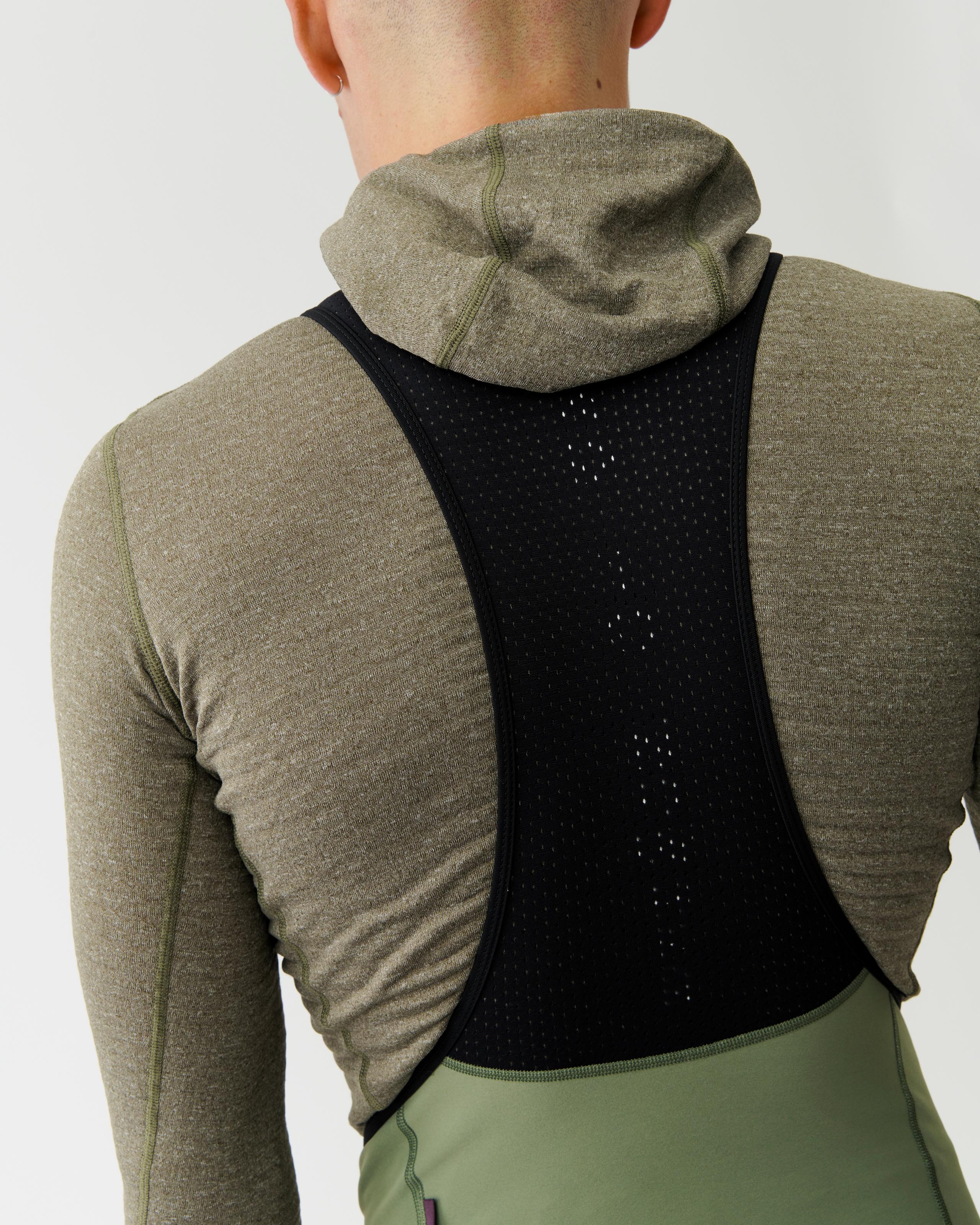 Grey Thermal Hooded Windproof base layer on model, rear view with black perforated back panel