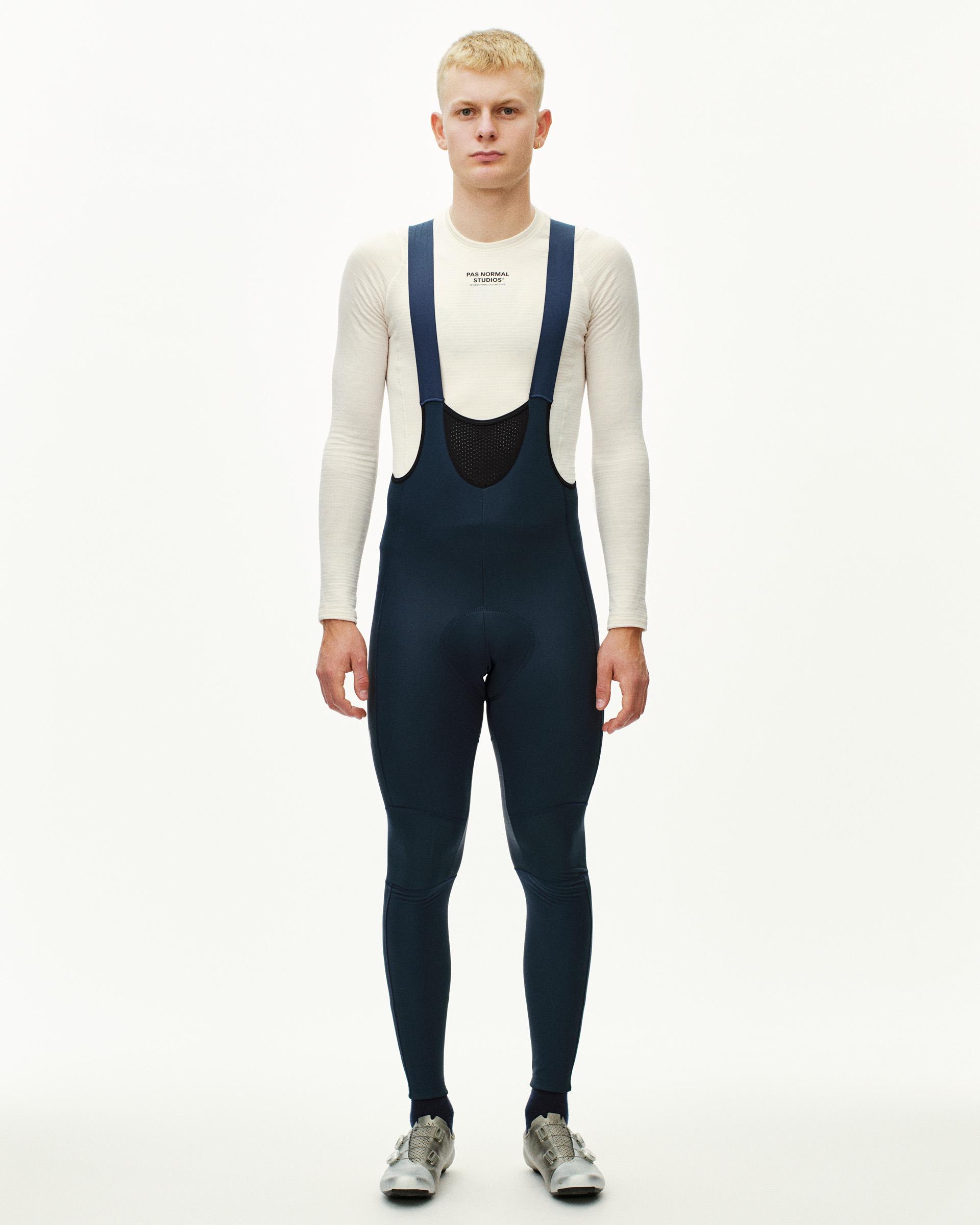 Navy Mechanism Deep Winter Long cycling bibs on model with mesh bib panel