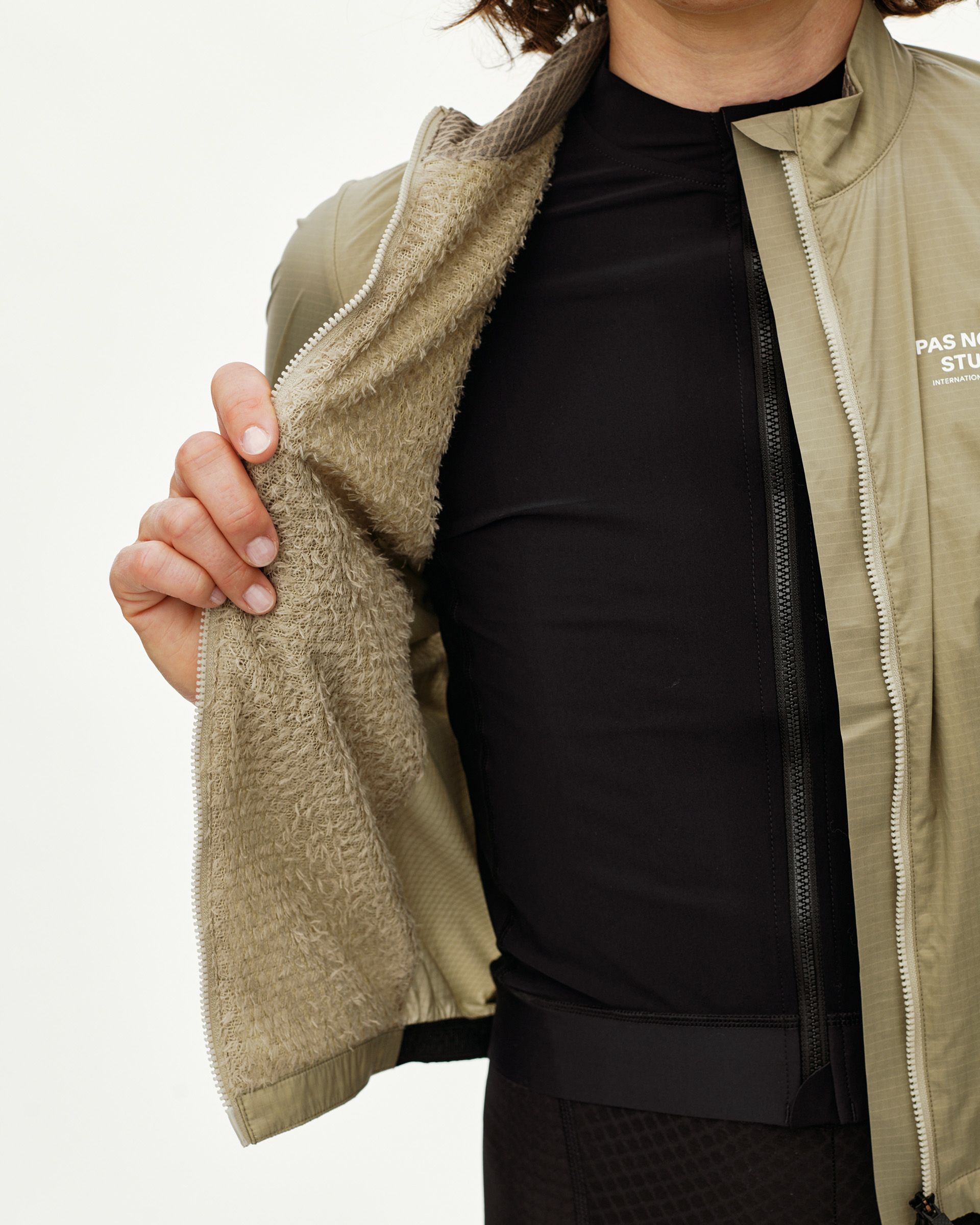 Grey Sage Essential Insulated jacket on model, detail view showing fleece inner lining