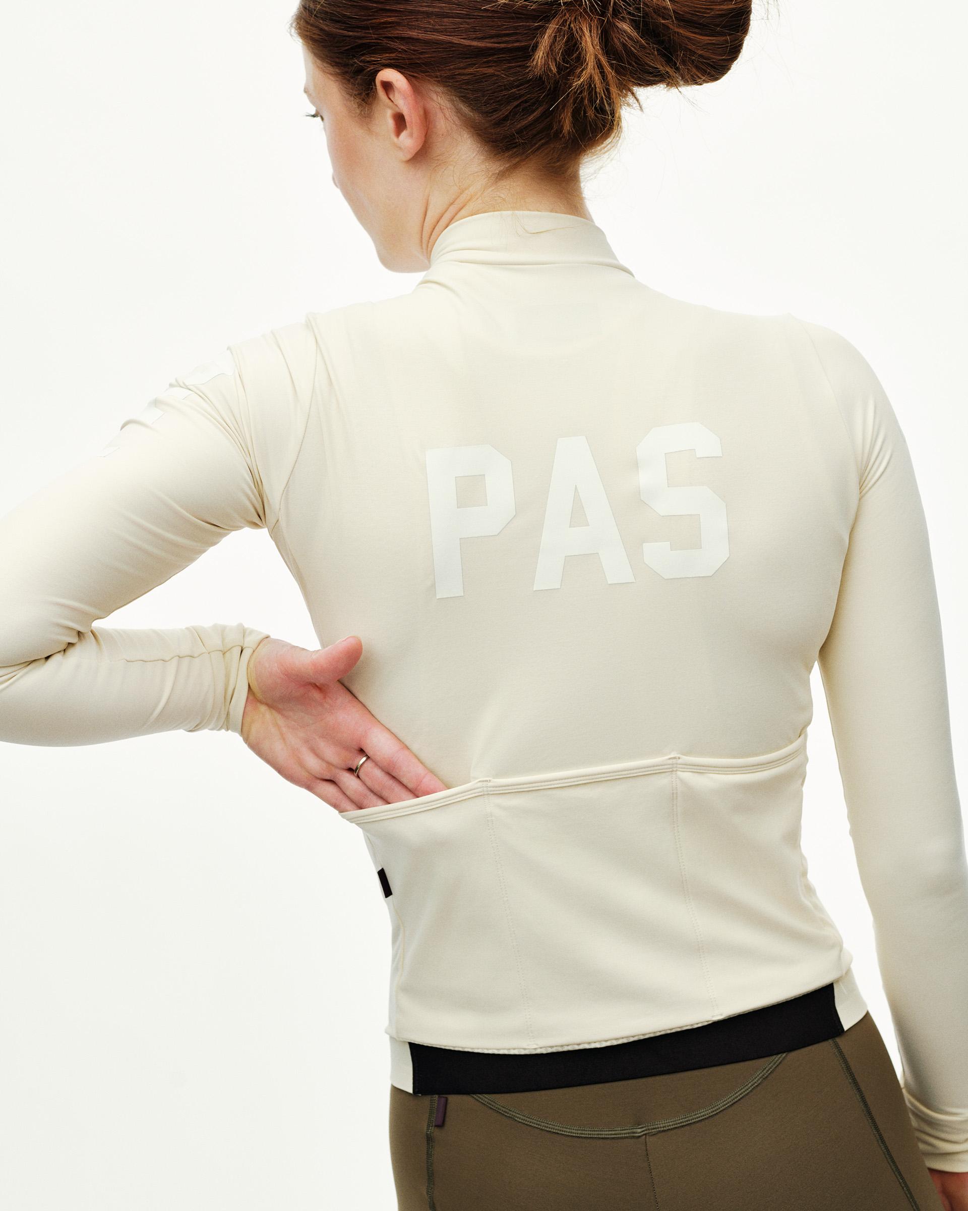 Sand PAS Mechanism women's long sleeve cycling jersey on model, rear view with tonal back print