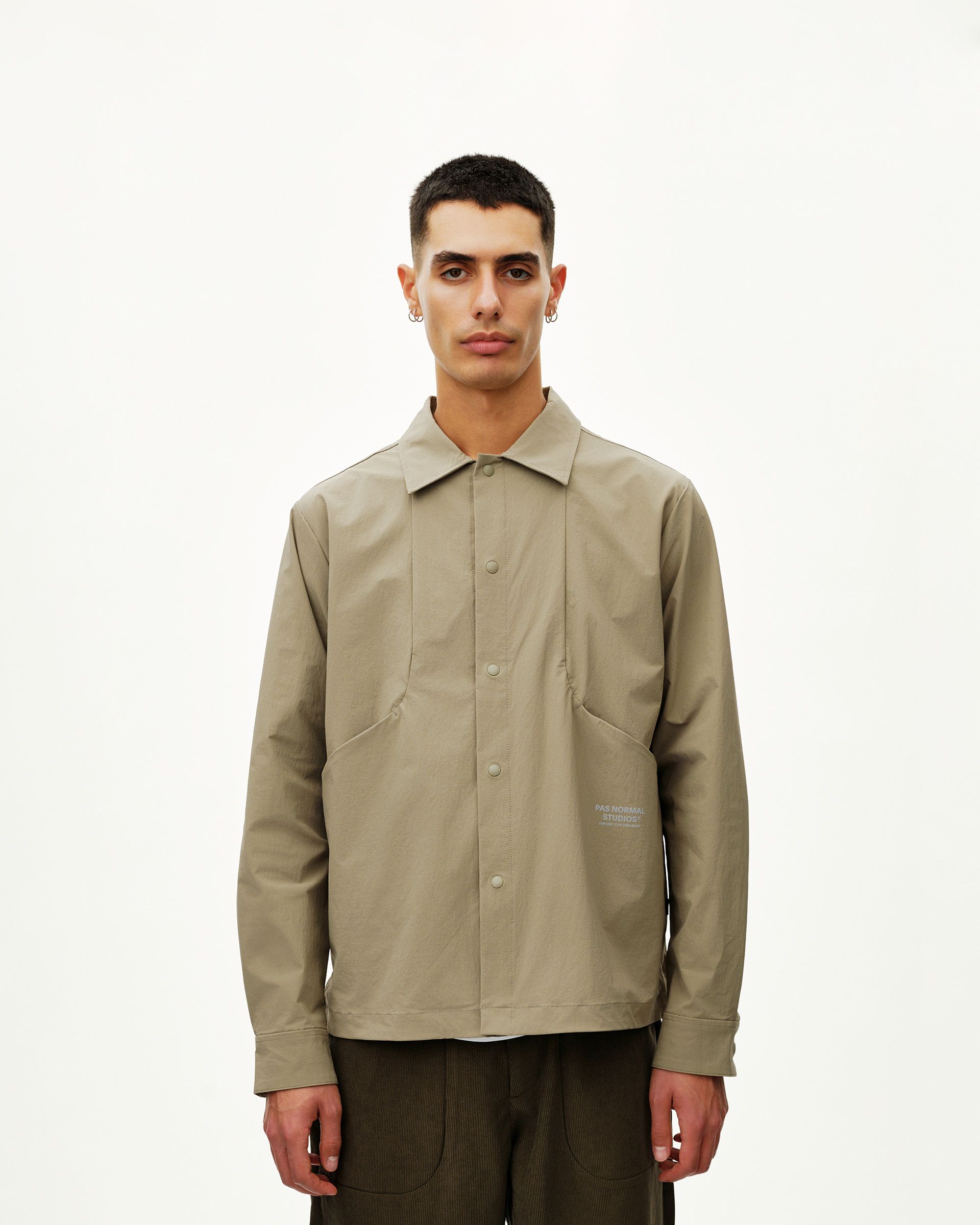 Dusty Earth khaki Off-Race Tech Overshirt on model, front view with snap button placket