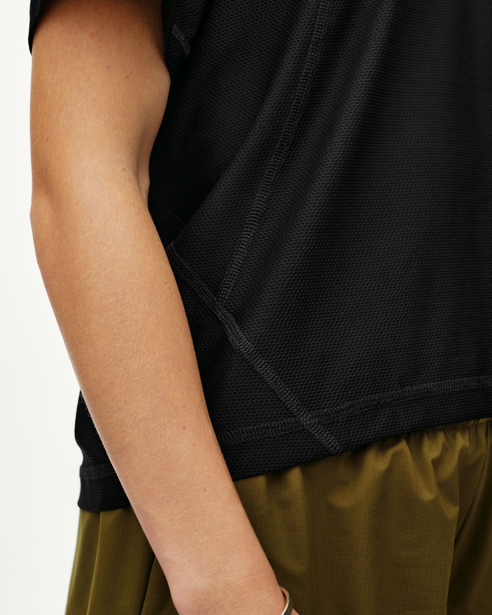Black Balance T-Shirt, side detail on model showing mesh fabric and flatlock seams