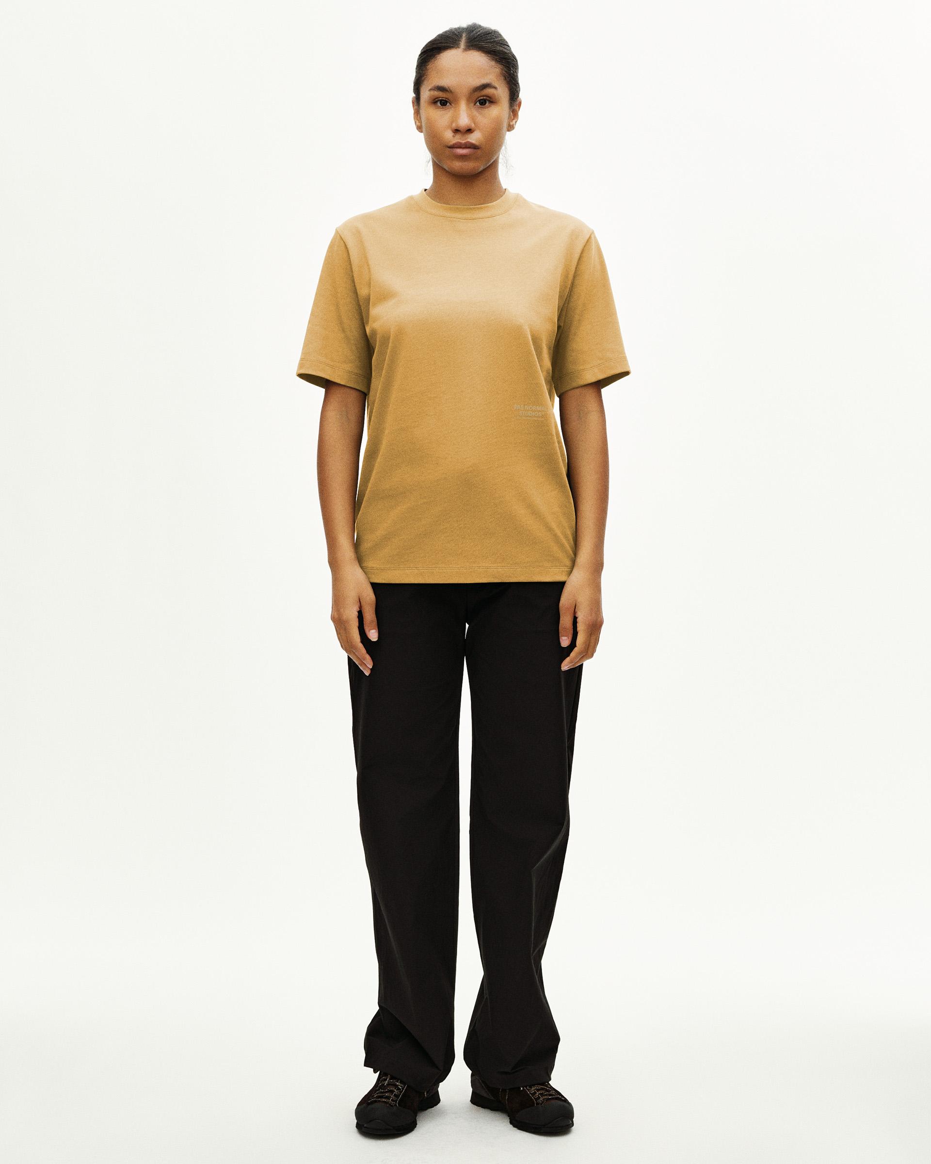 Sandstone Off-Race T-shirt on model, front view with small chest text print
