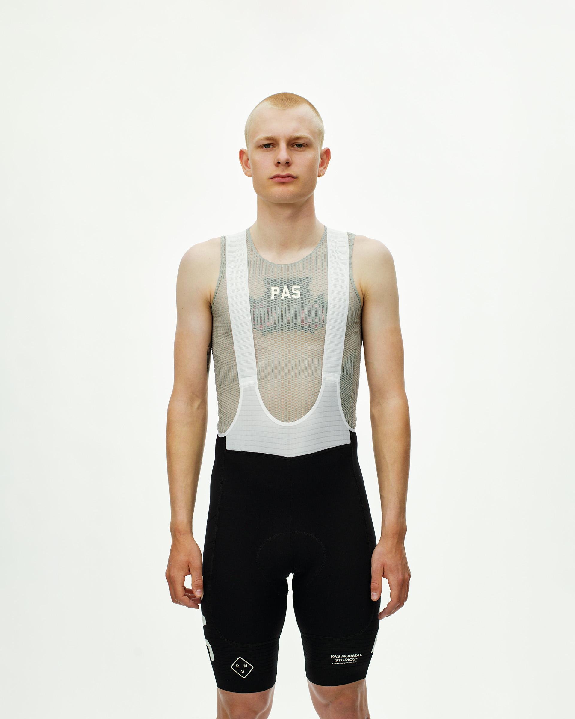 Black PAS Mechanism Pro cycling bibs on model with white mesh bib straps