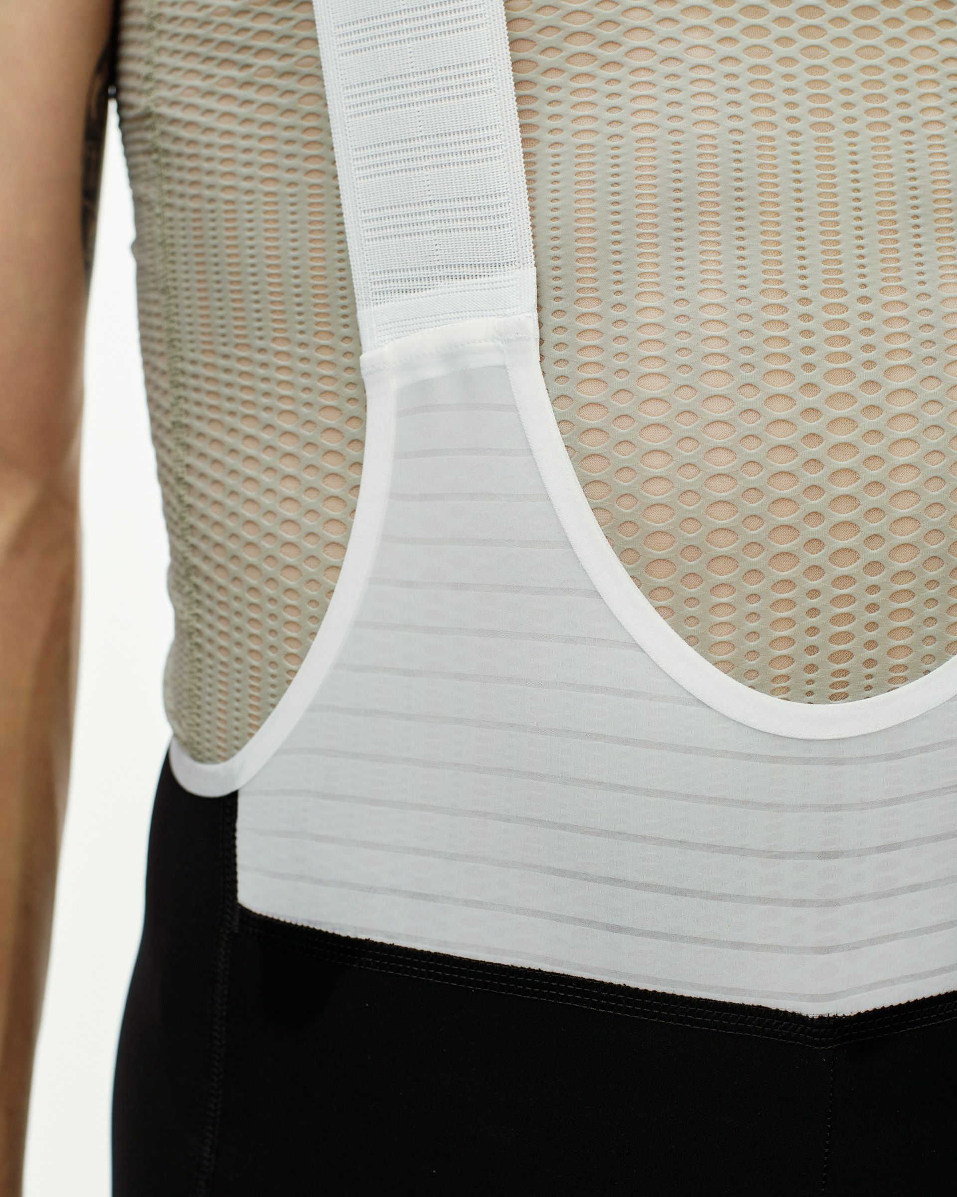 Black PAS Mechanism Pro bibs, side detail view showing mesh back panel and ribbed waistband