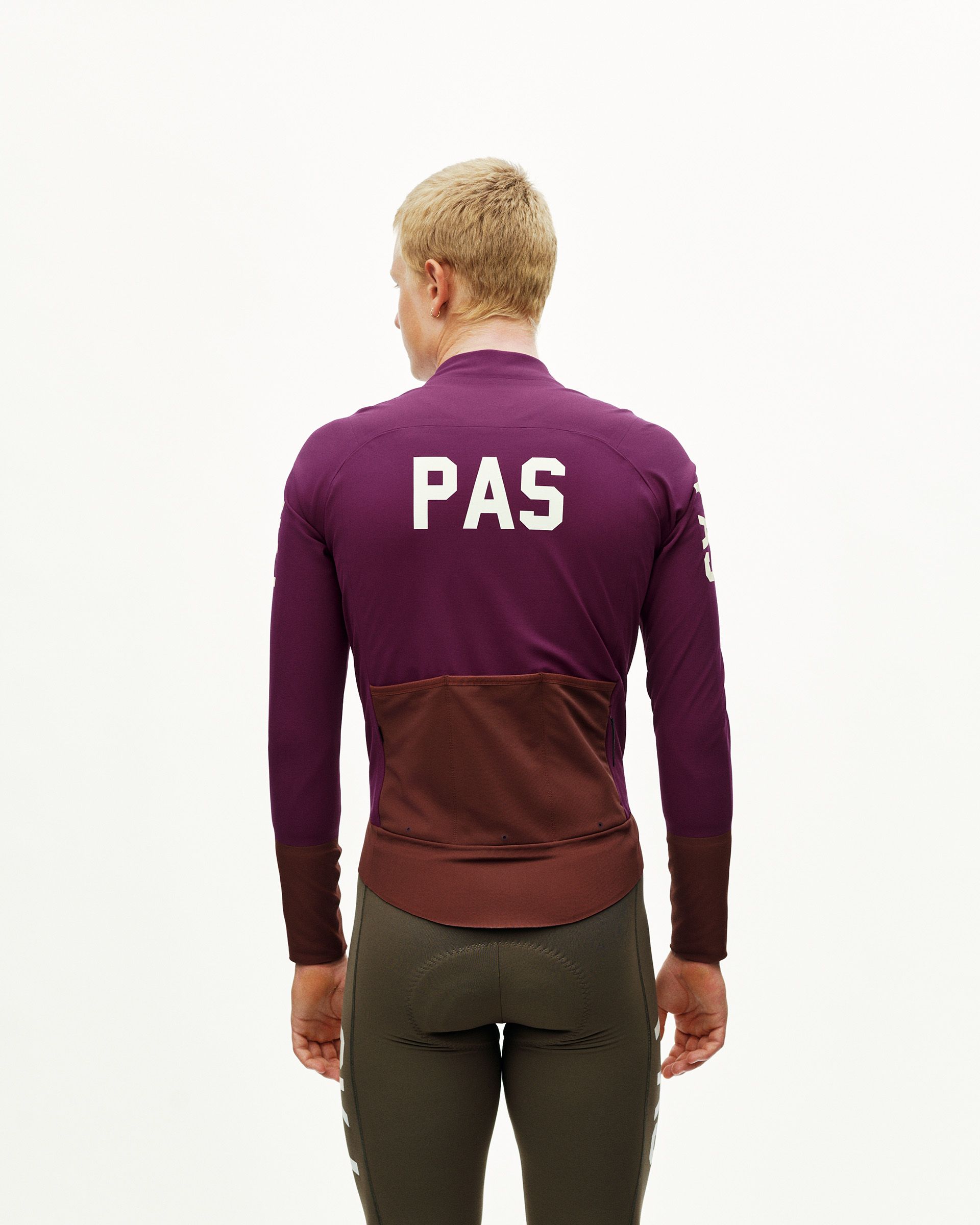 Dark Purple PAS Mechanism Thermal cycling jacket on model, rear view with white back print and contrast dark panel