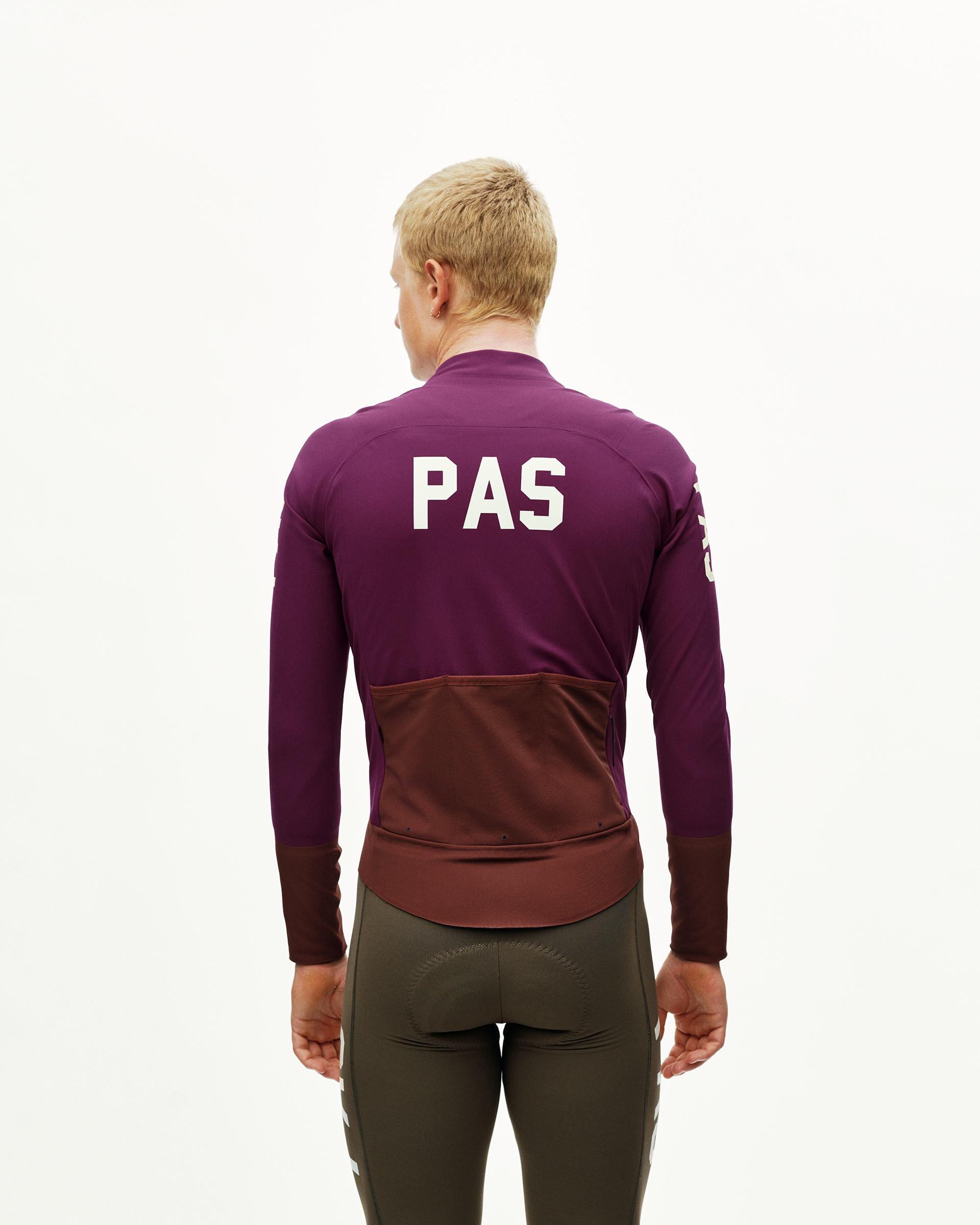 Dark Purple PAS Mechanism Thermal cycling jacket on model, rear view with white back print and contrast dark panel