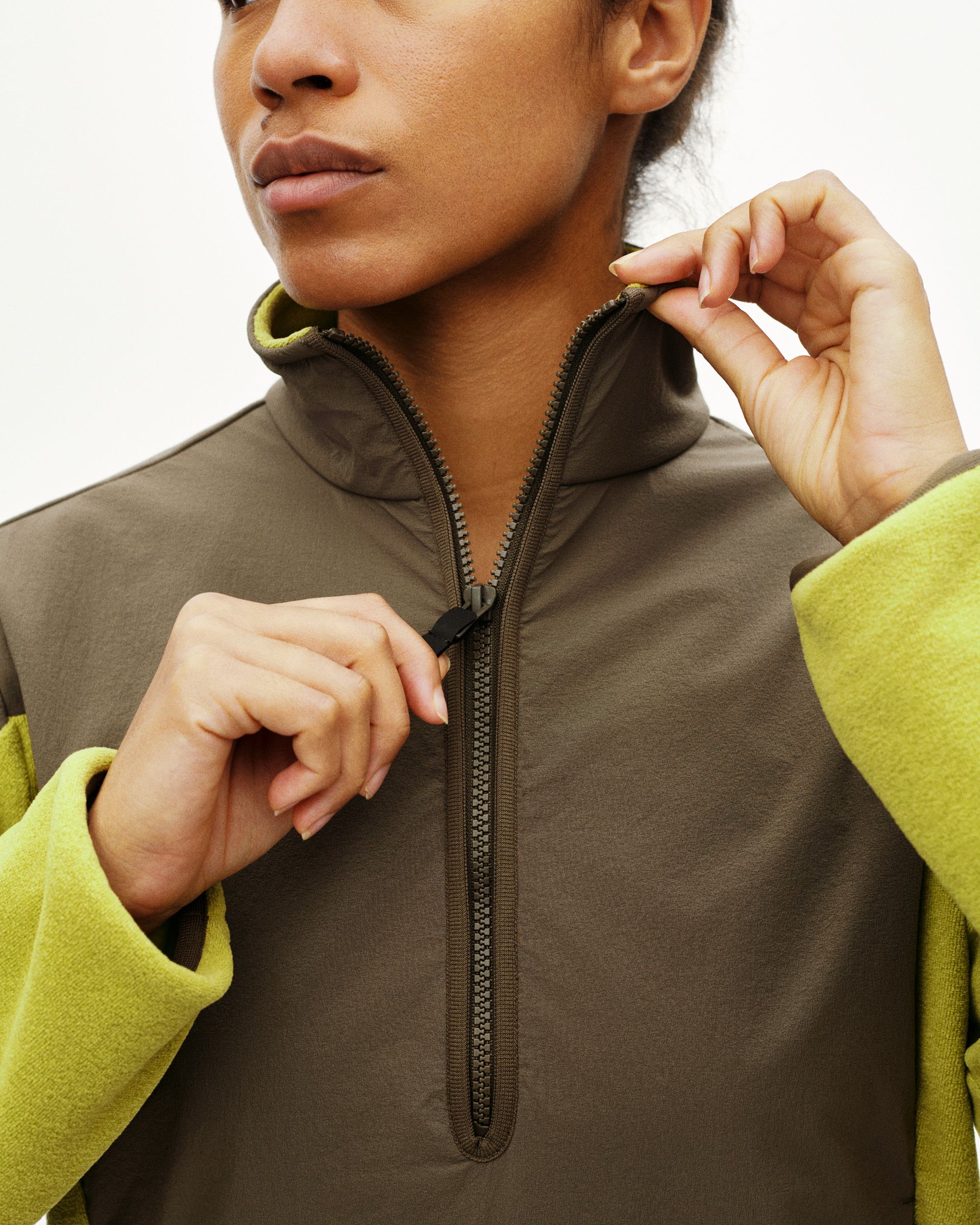 Moss Green Off-Race Light Fleece half-zip on model with yellow contrast sleeves and collar