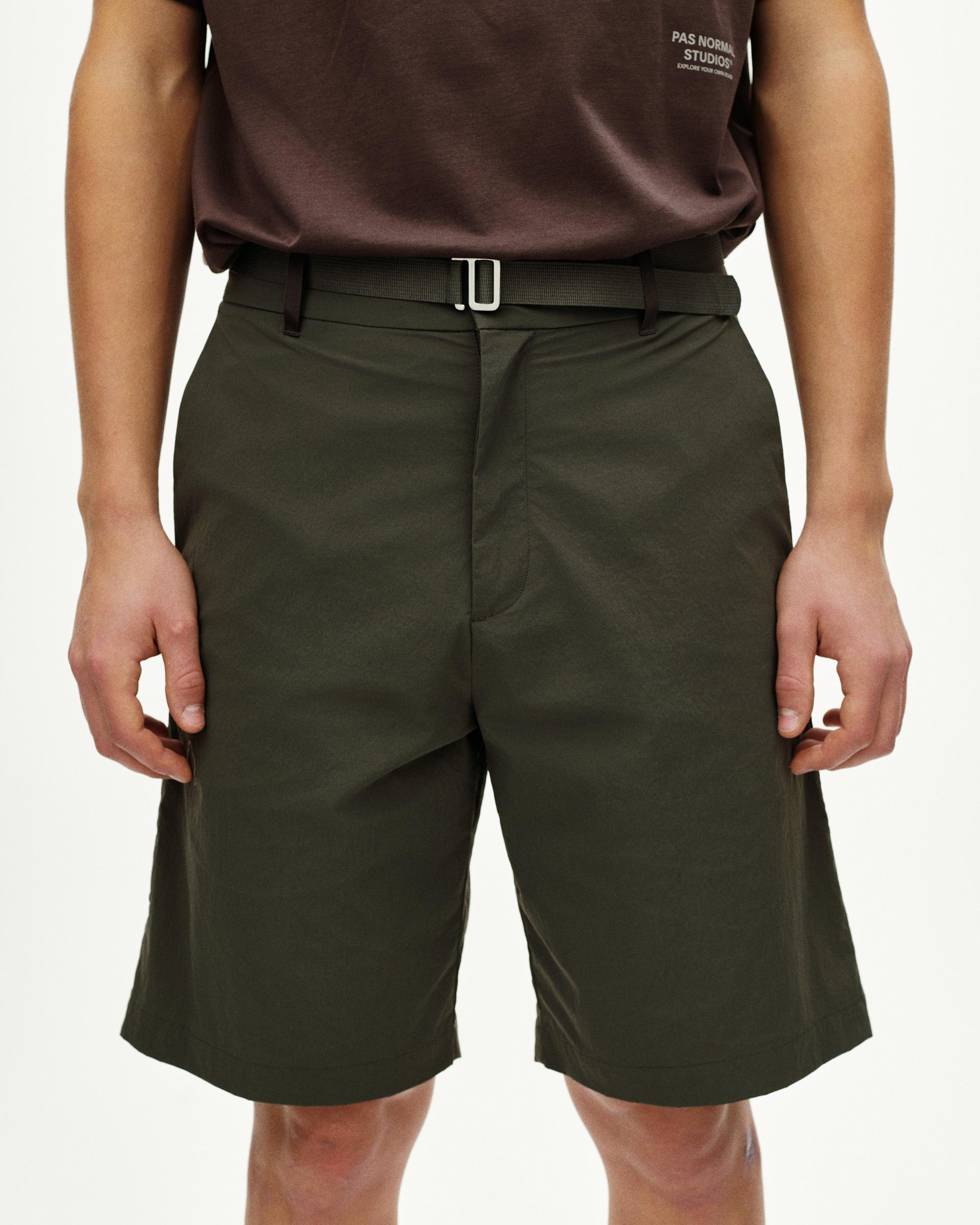 Dark Grey Off-Race Light Tech shorts on model, front view with adjustable waist belt