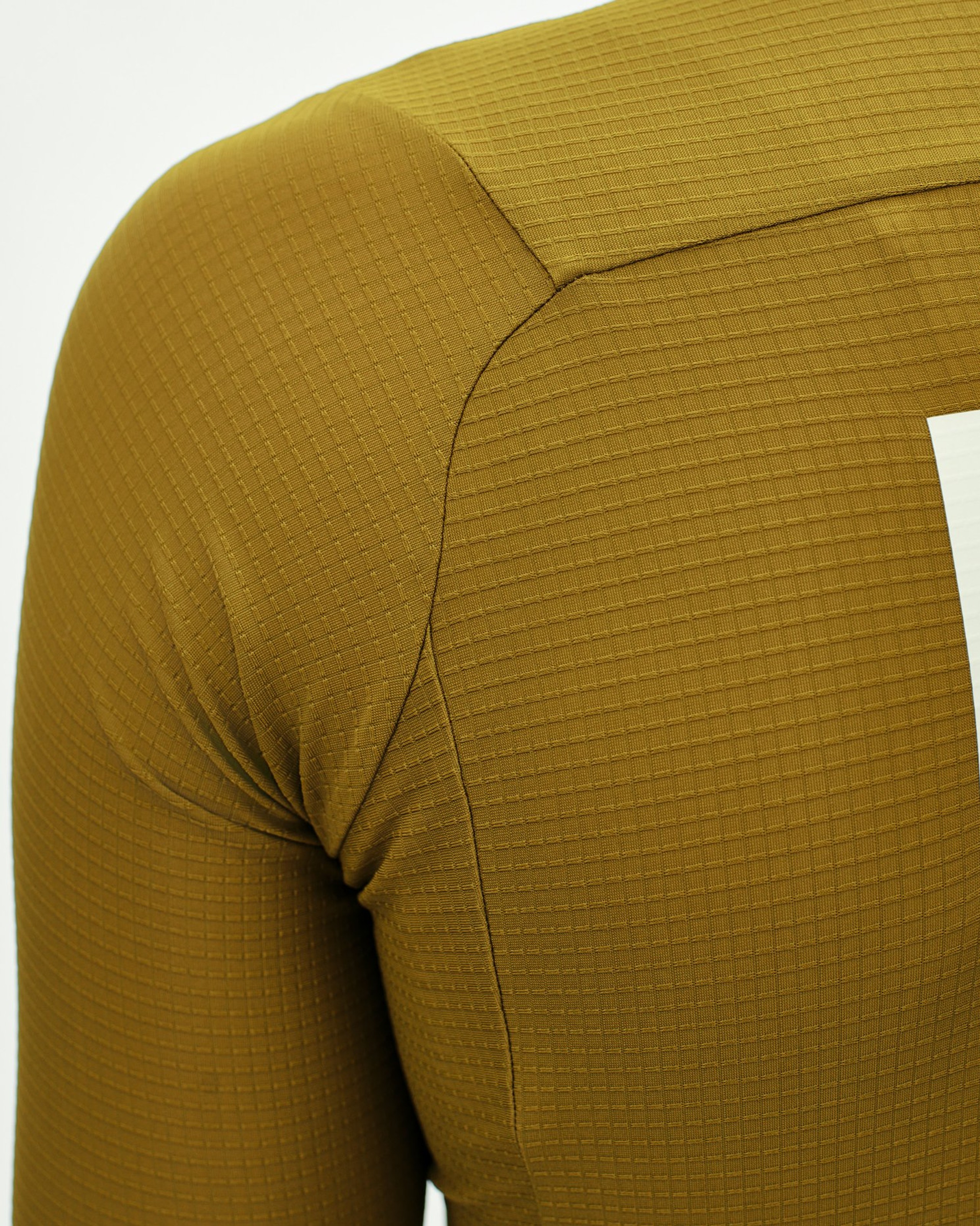 Yellow PAS Mechanism Pro long sleeve cycling jersey, detail view showing textured fabric and seam construction