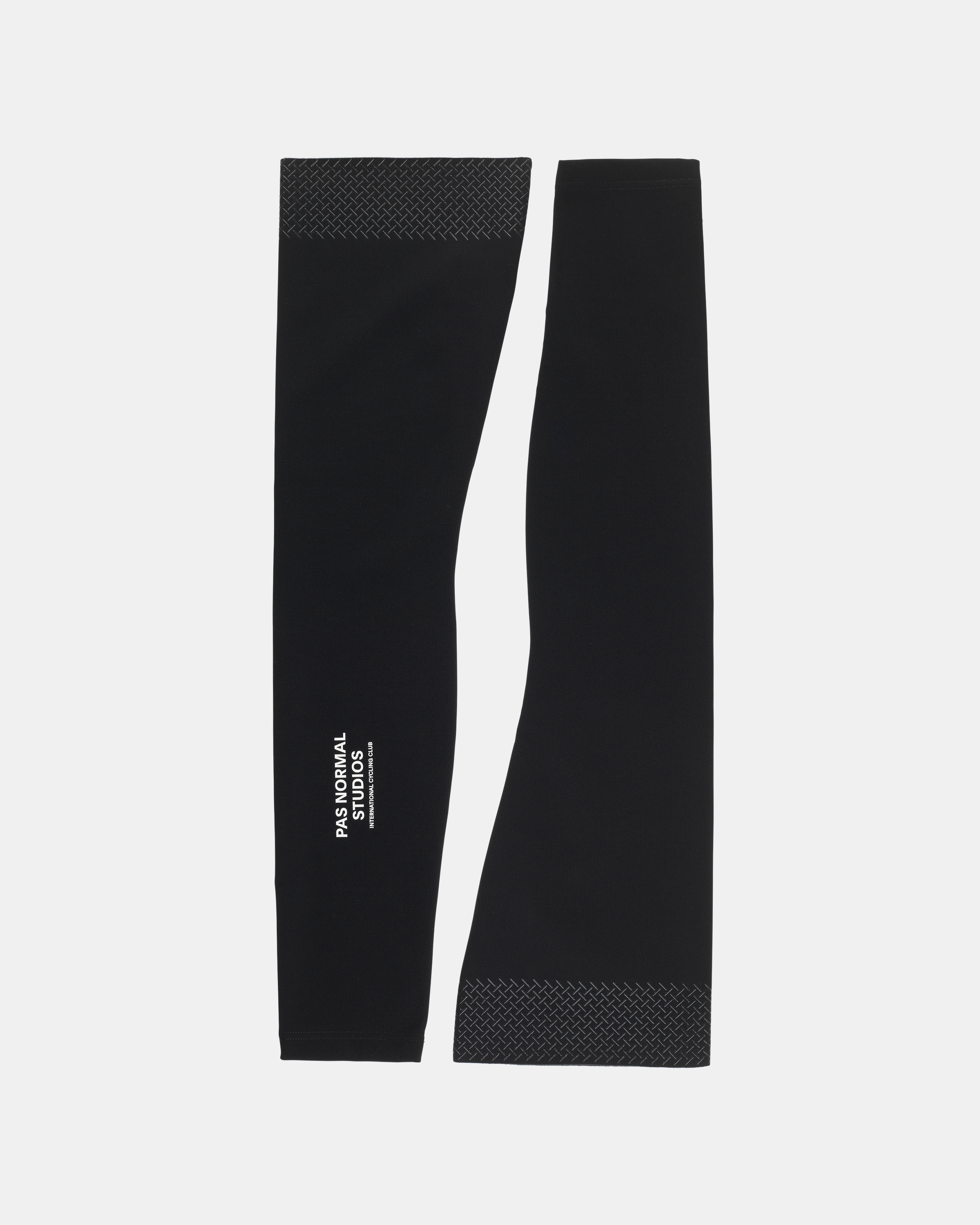 Black Logo leg warmers, flat lay pair with textured cuffs and white branding