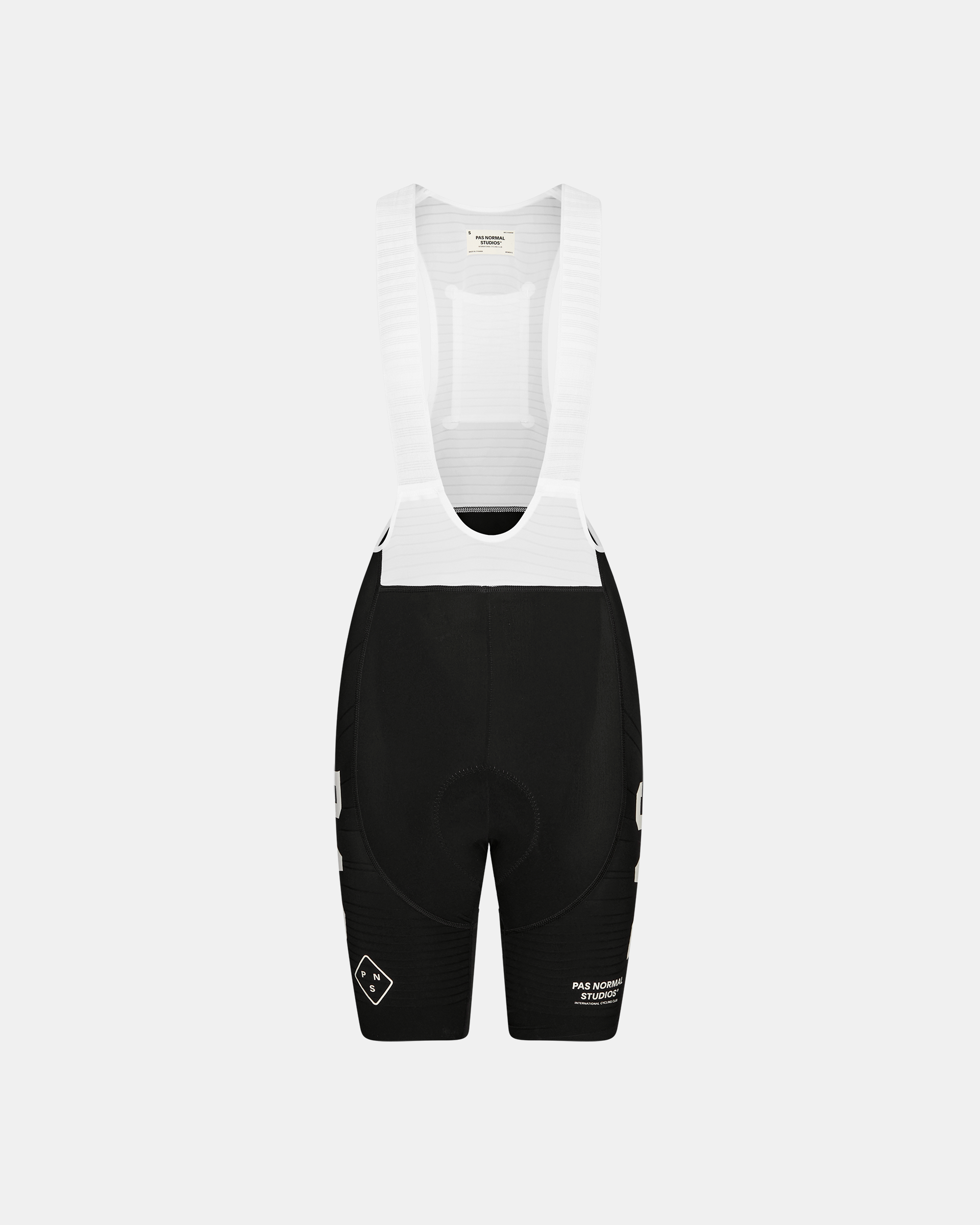 Black PAS Mechanism Pro cycling bibs, front flat lay with white bib straps and mesh back panel