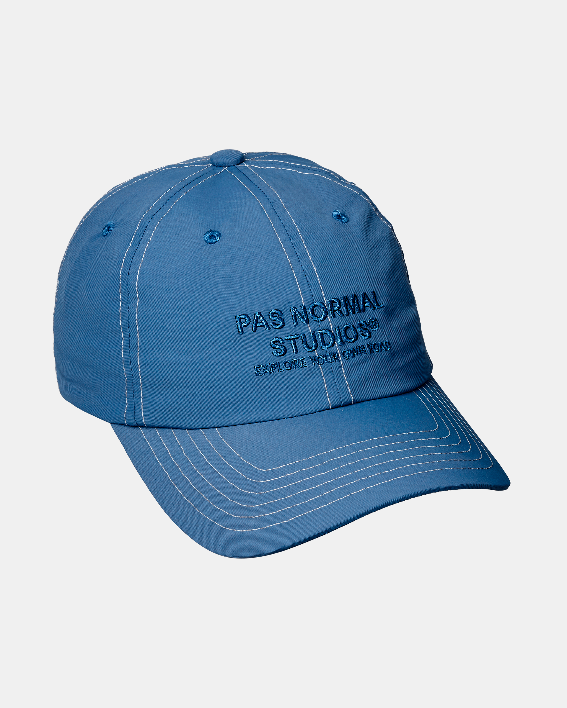 Ocean Blue Off-Race cap, three-quarter view with contrast white stitching and embroidered front logo