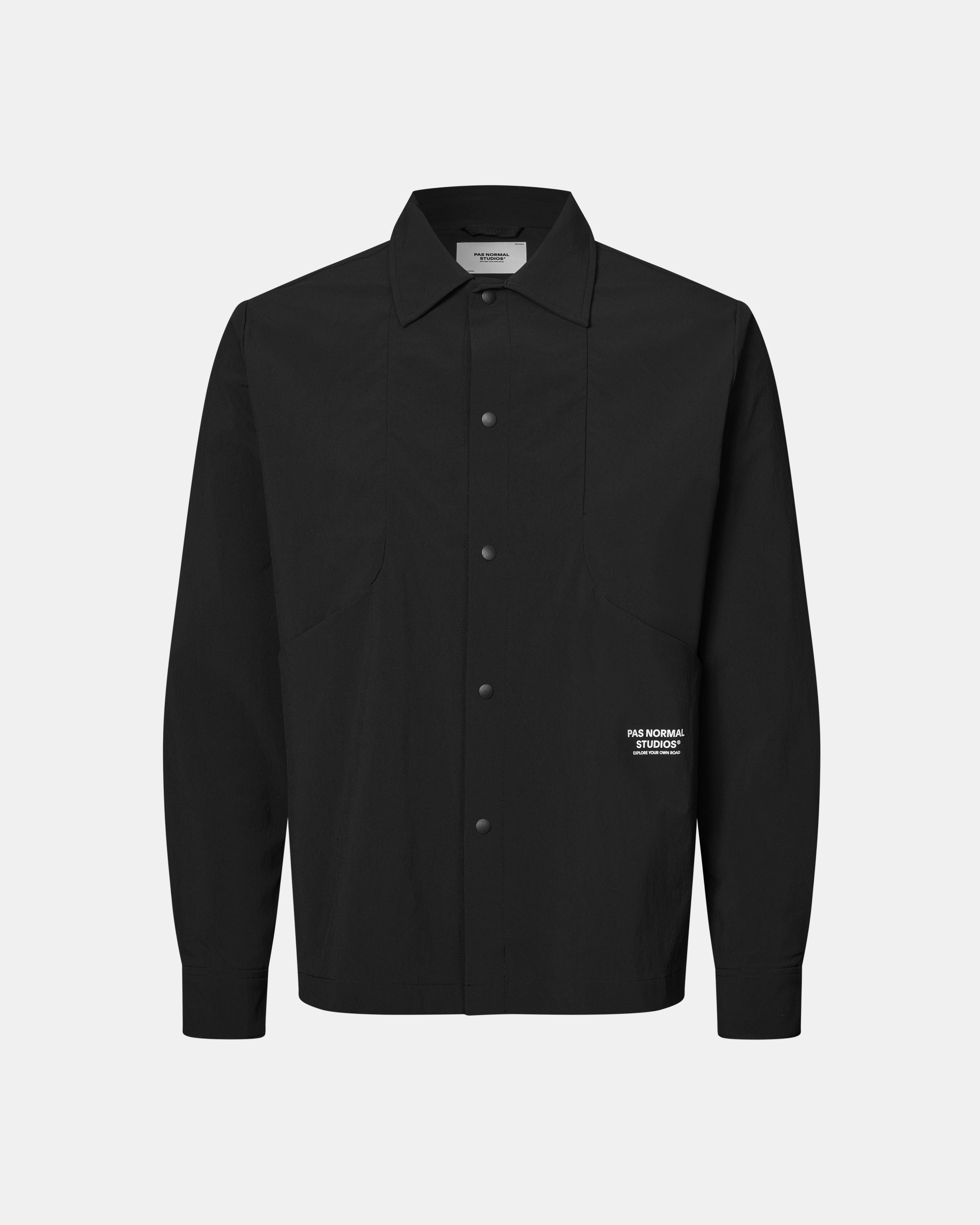 Black Off-Race Tech Overshirt, front view with snap button closure and white logo patch