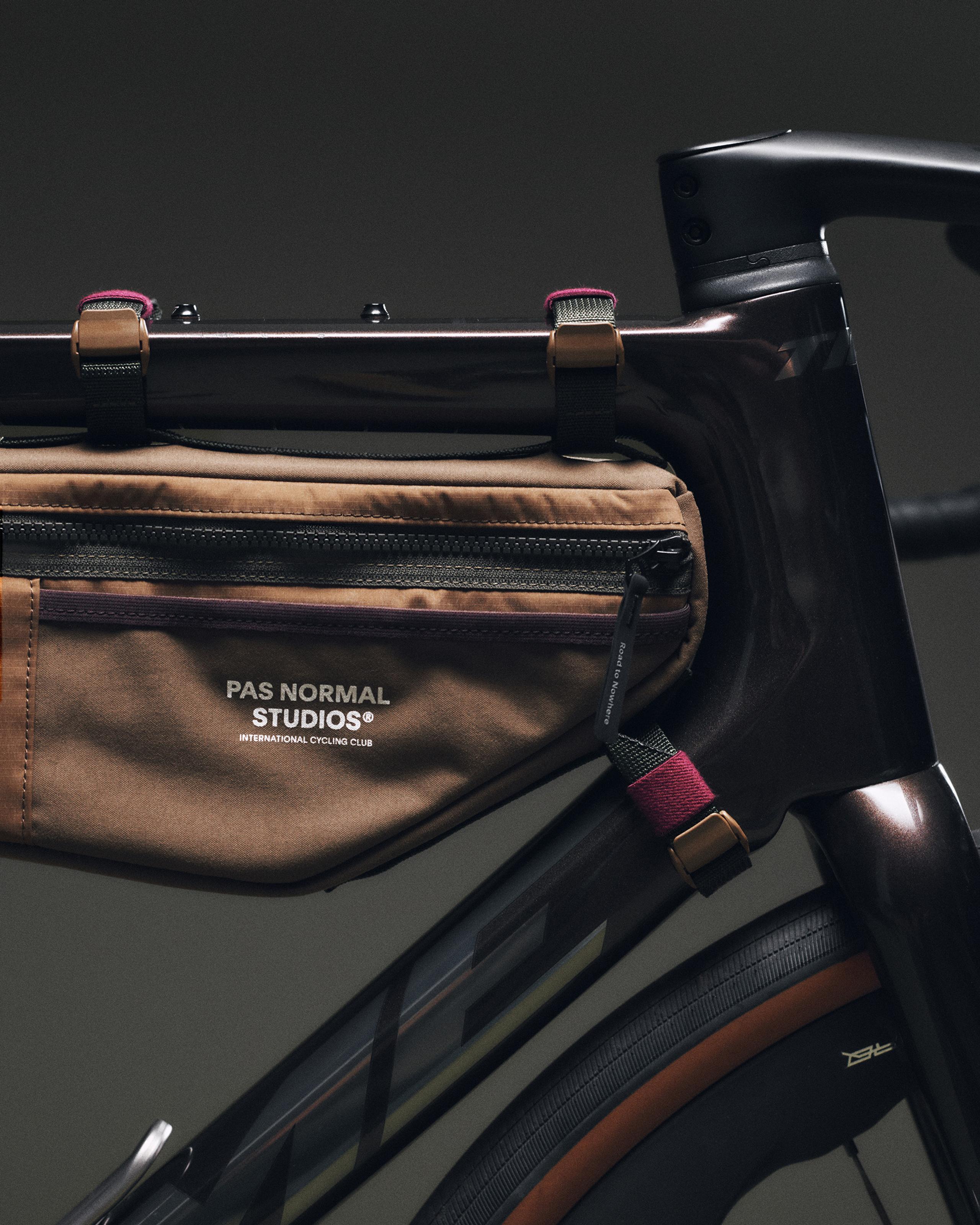 Light Brown Porter-Yoshida frame bag mounted on road bike, side detail view with zip pocket and tan buckle straps