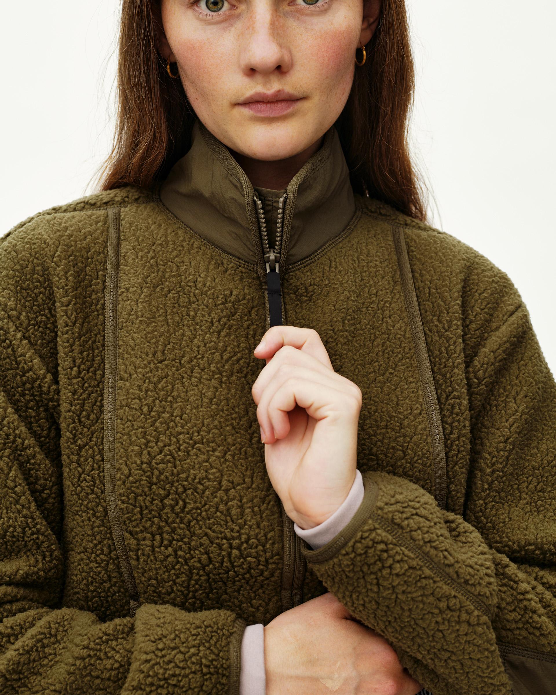 Deep Olive Off-Race Pile Fleece jacket on model, front detail view with full zip and mock neck collar