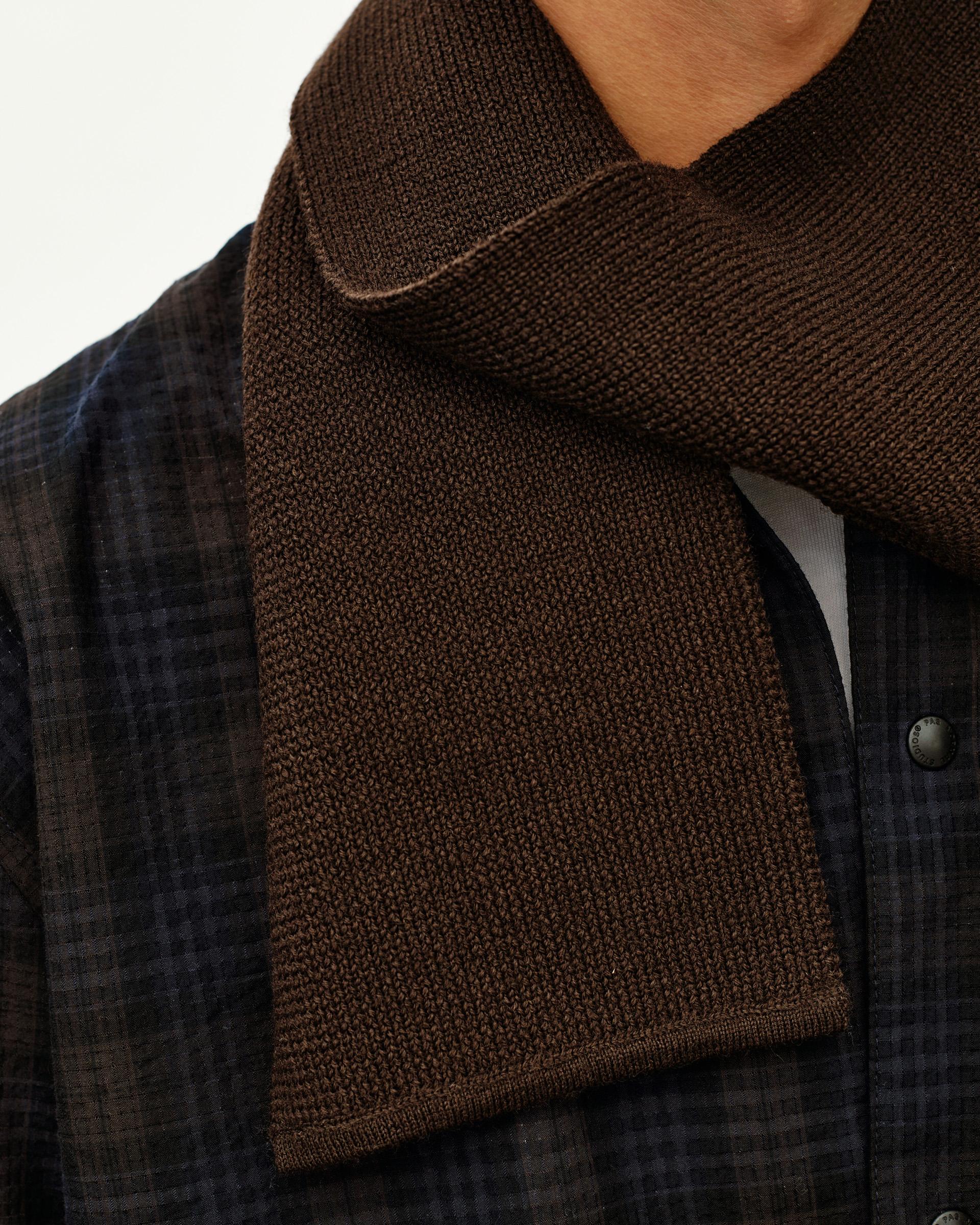 Light Brown Off-Race Wool Knit scarf on model, detail view showing knit texture and folded drape