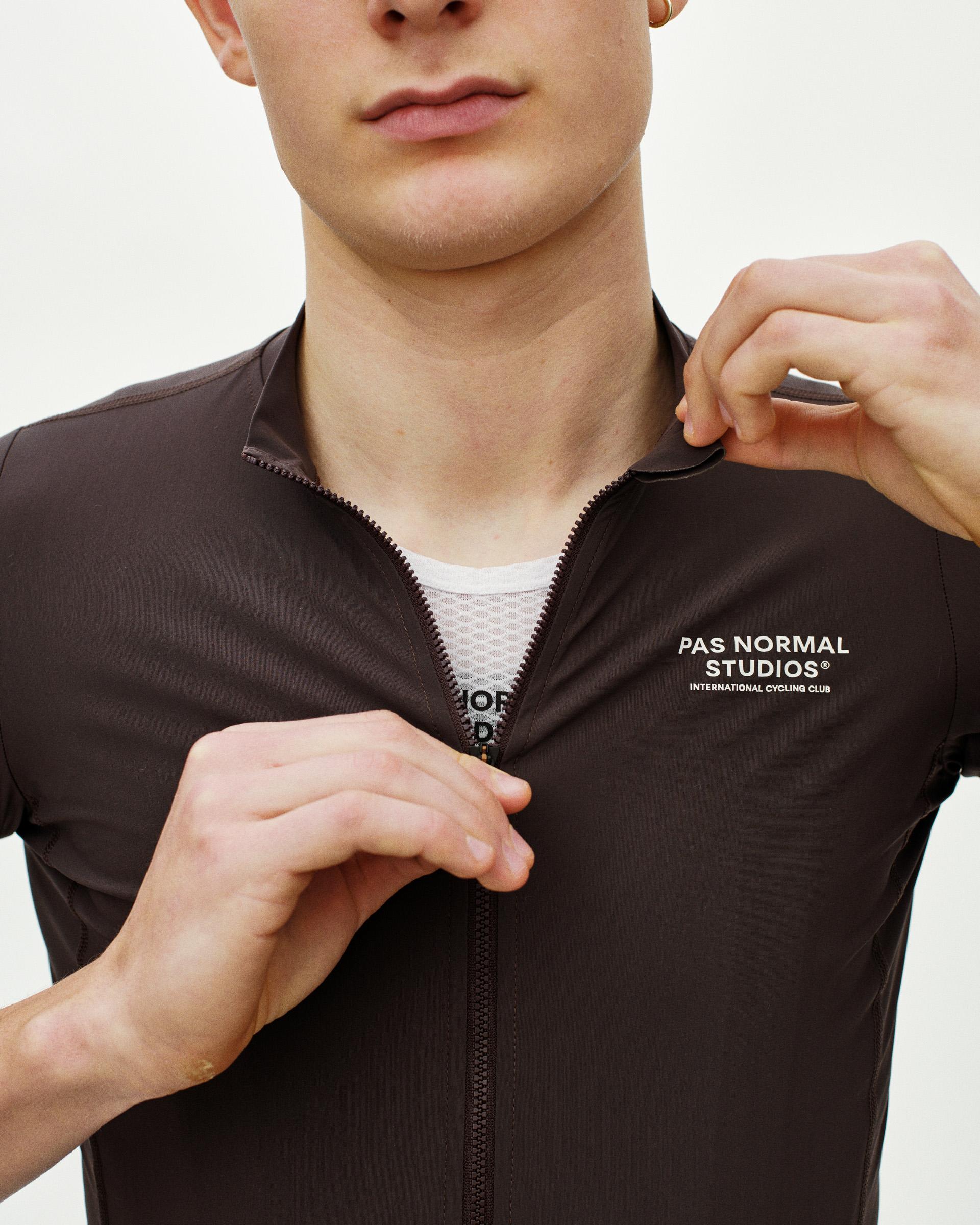Dark Purple Essential cycling jersey on model with quarter zip and white chest logo