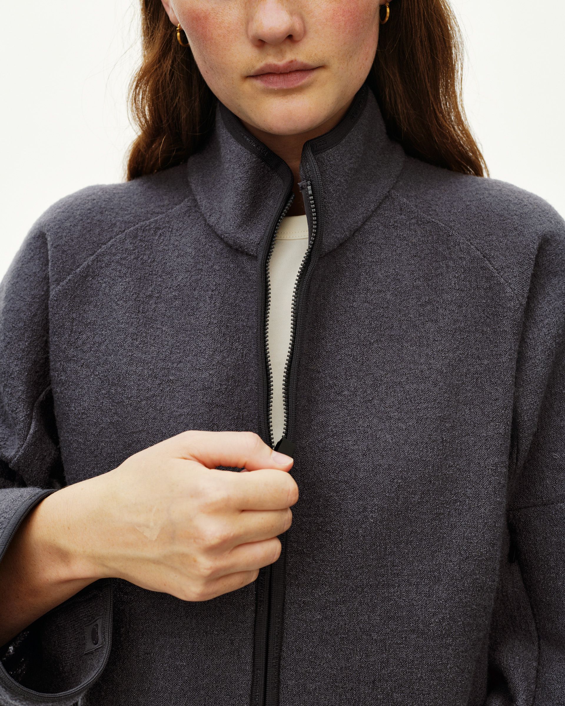 Steel grey Off-Race Boiled Wool jacket on model, front detail view with open full zip and stand collar