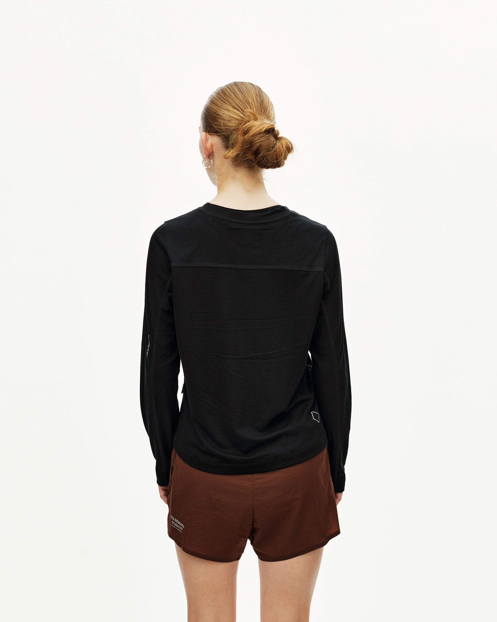 Black Balance long sleeve T-shirt on model, rear view with mixed texture paneling