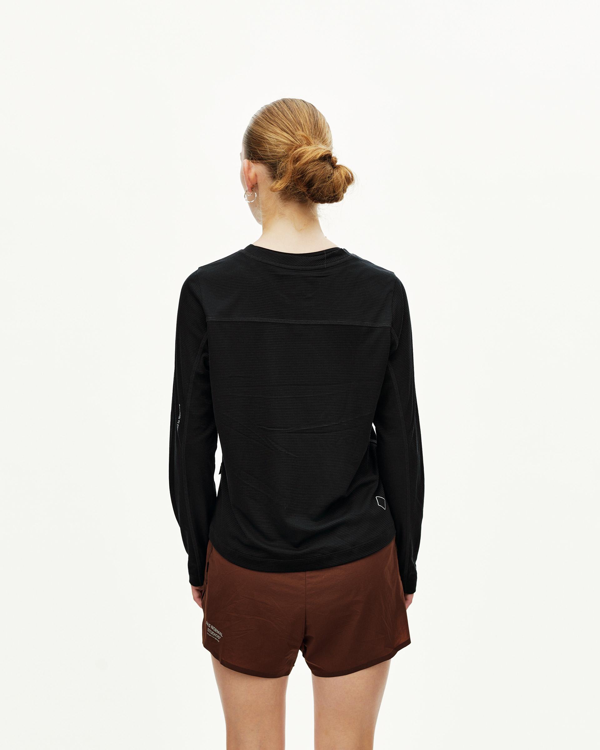 Black Balance long sleeve T-shirt on model, rear view with mixed texture paneling