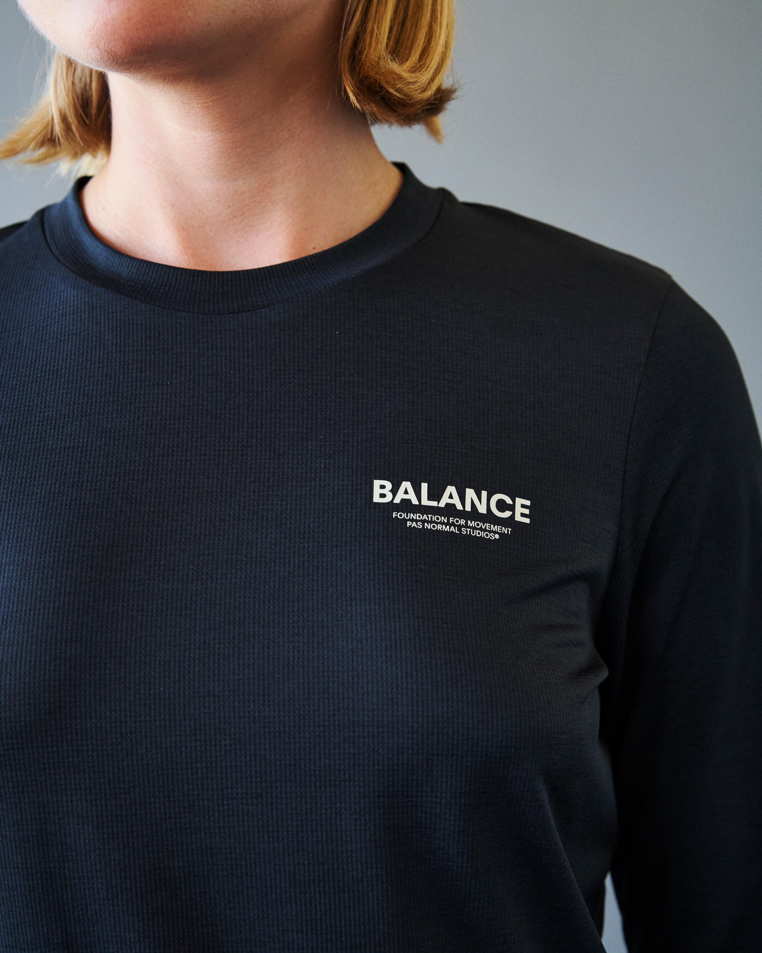 Black Balance long sleeve t-shirt on model with white chest branding