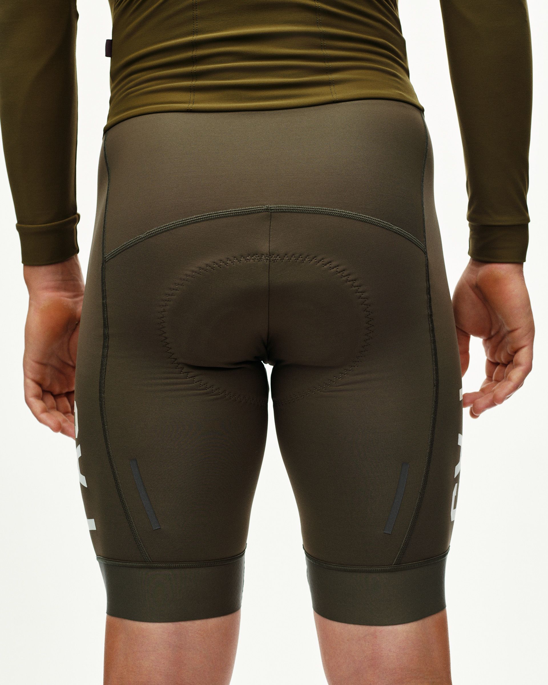 Moss Brown PAS cycling speedsuit on model, rear view with contrast leg print