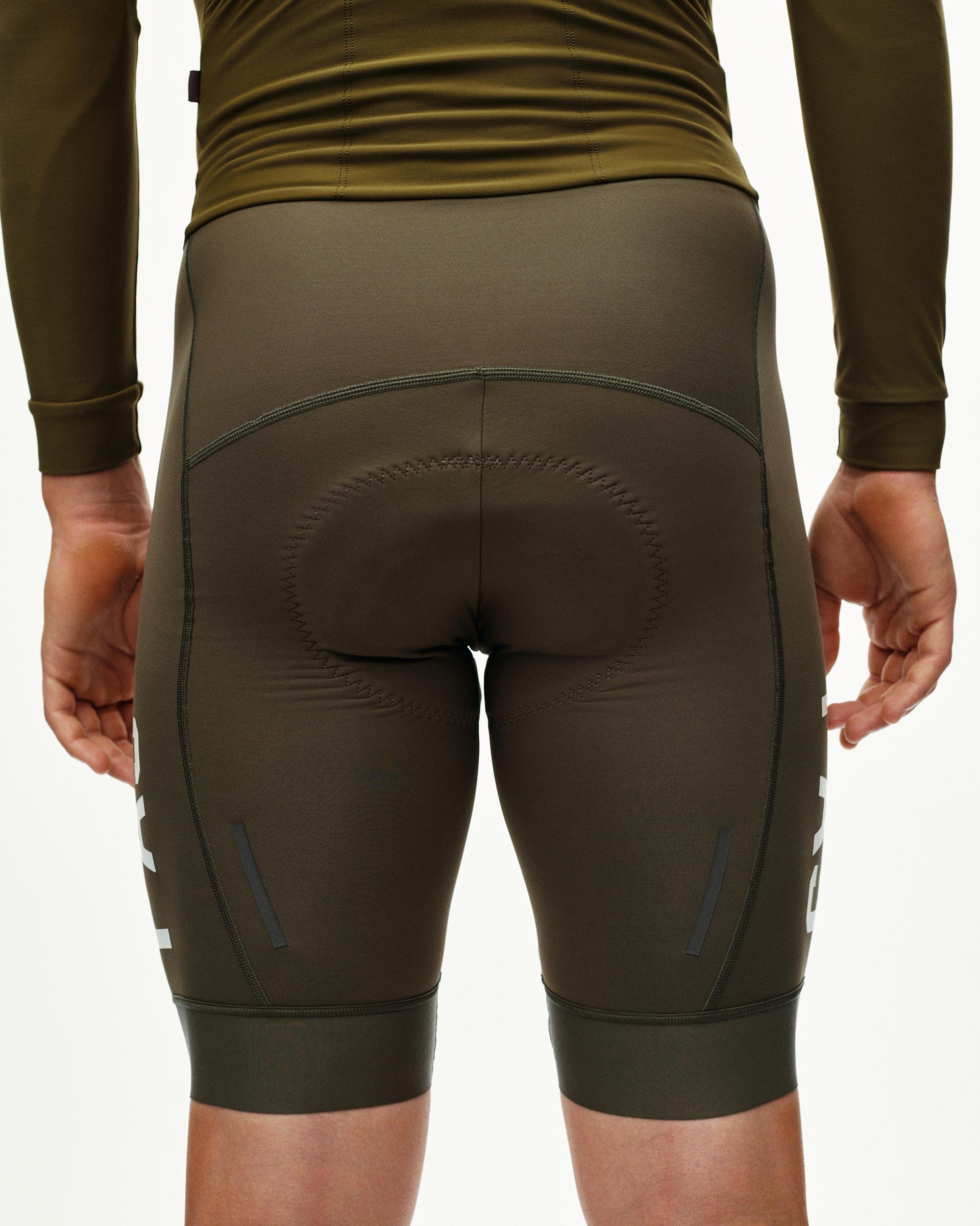 Moss Brown PAS cycling speedsuit on model, rear view with contrast leg print