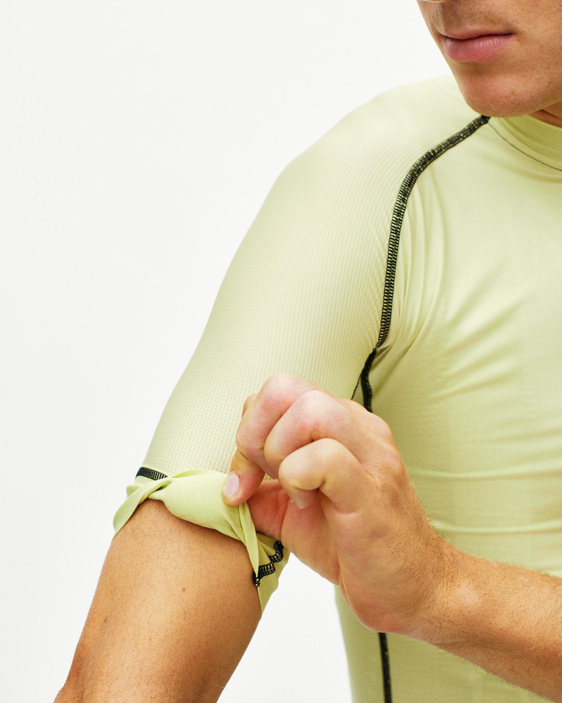 Green Mechanism cycling jersey on model with contrast zip detail