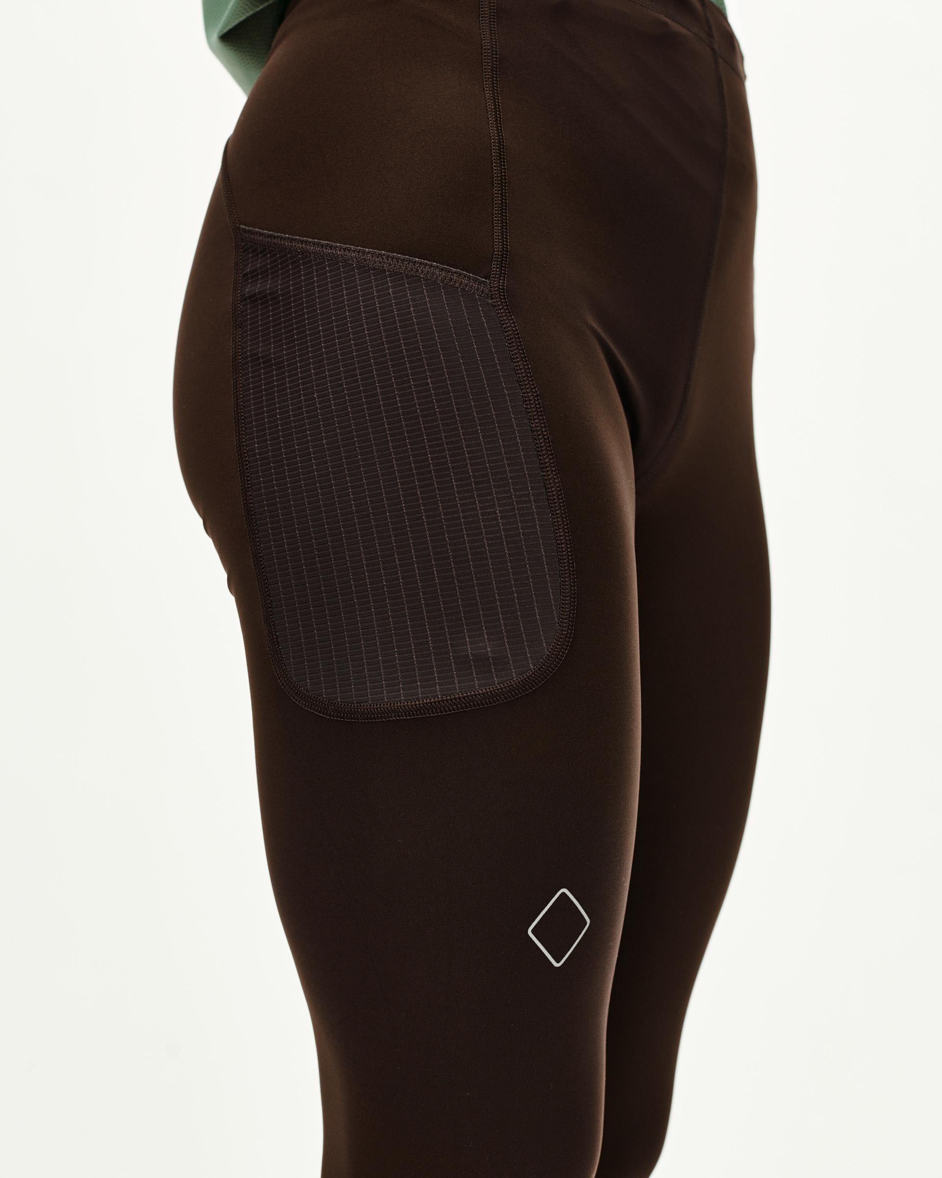 Dark Coffee brown Balance women's long tights, side detail on model with contrast ripstop thigh pocket