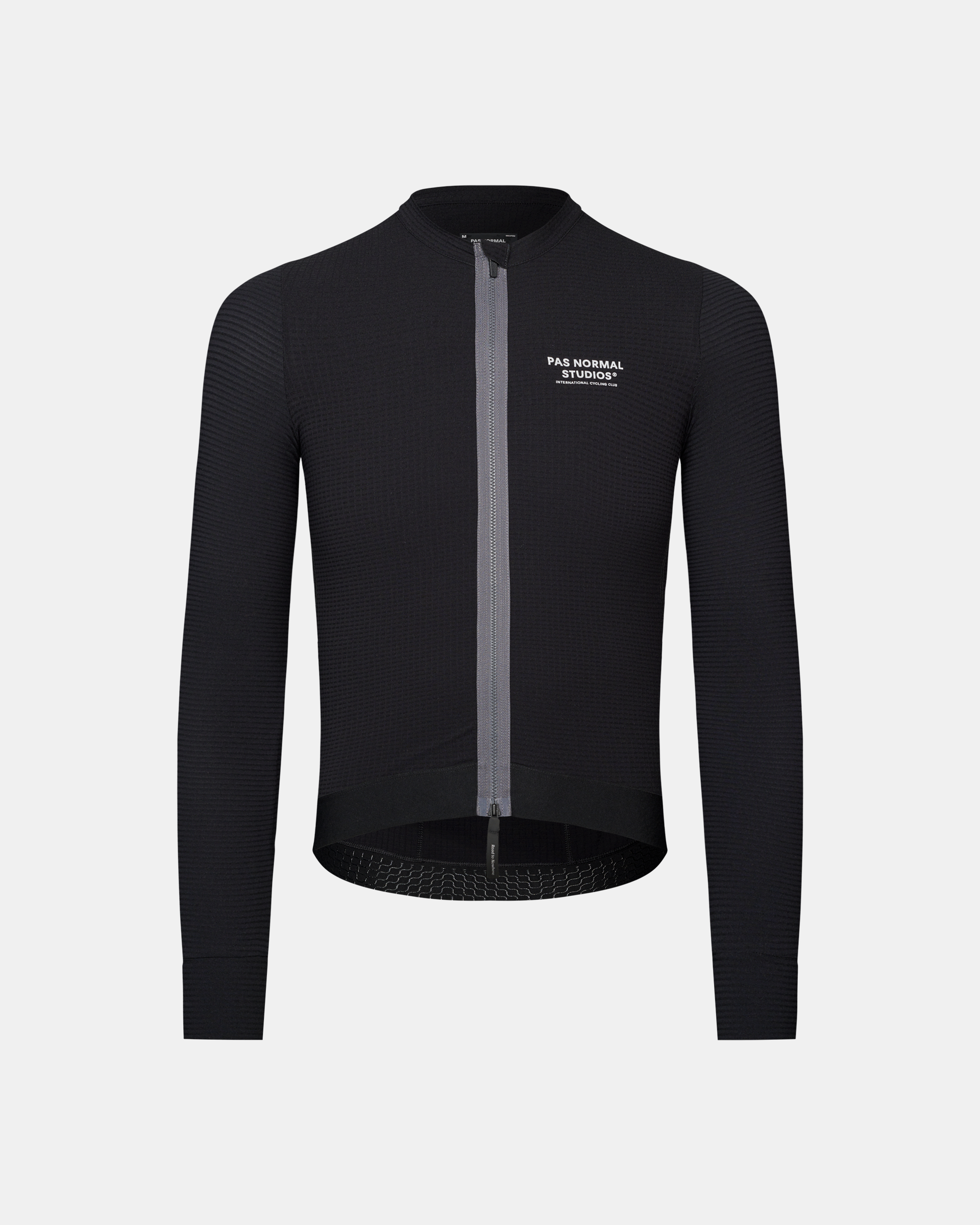 Black Escapism long sleeve cycling jersey, front view with textured fabric and white chest logo