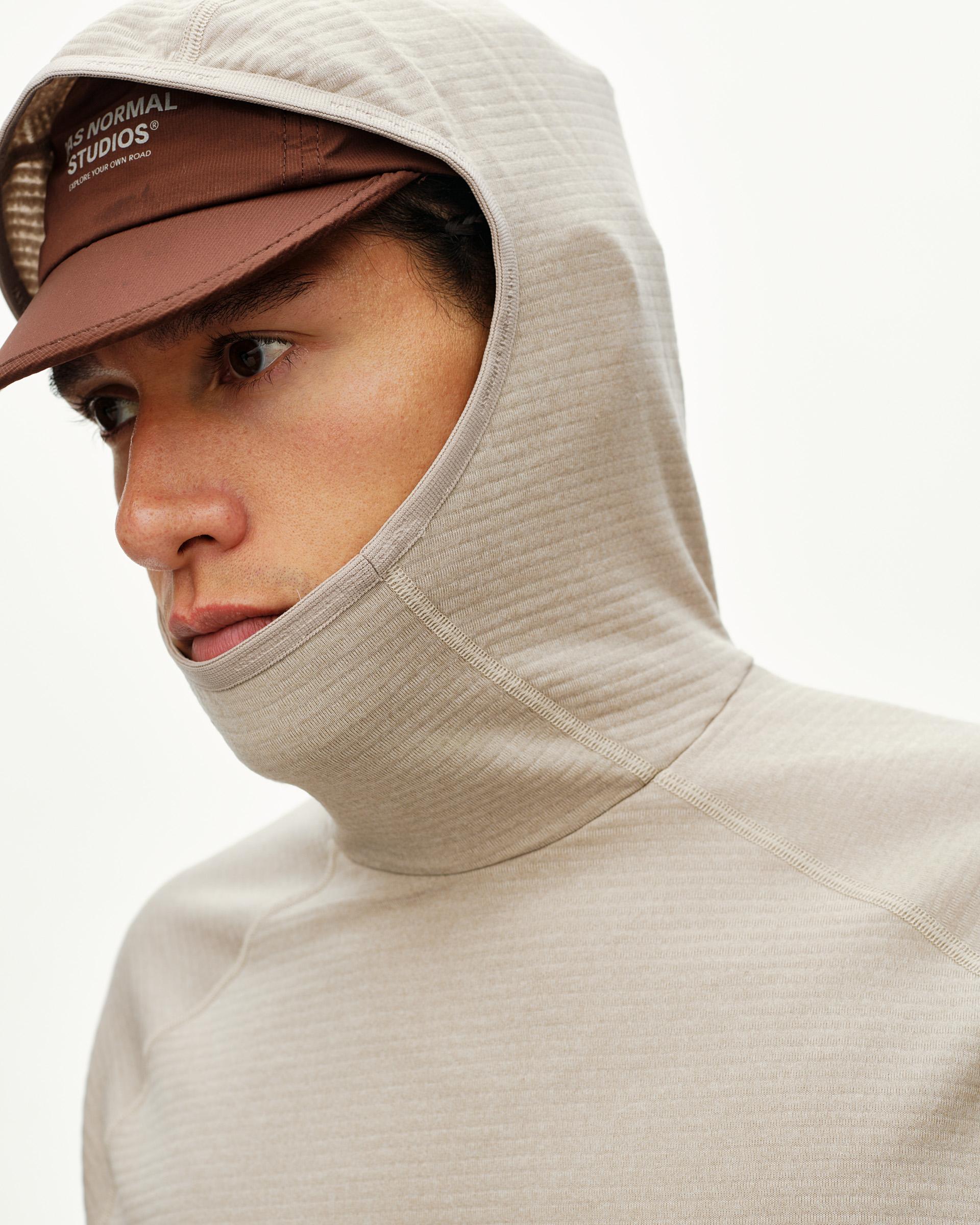 Haze purple Balance Thermal cycling hoodie on model, close-up detail showing ribbed hood and integrated neck gaiter
