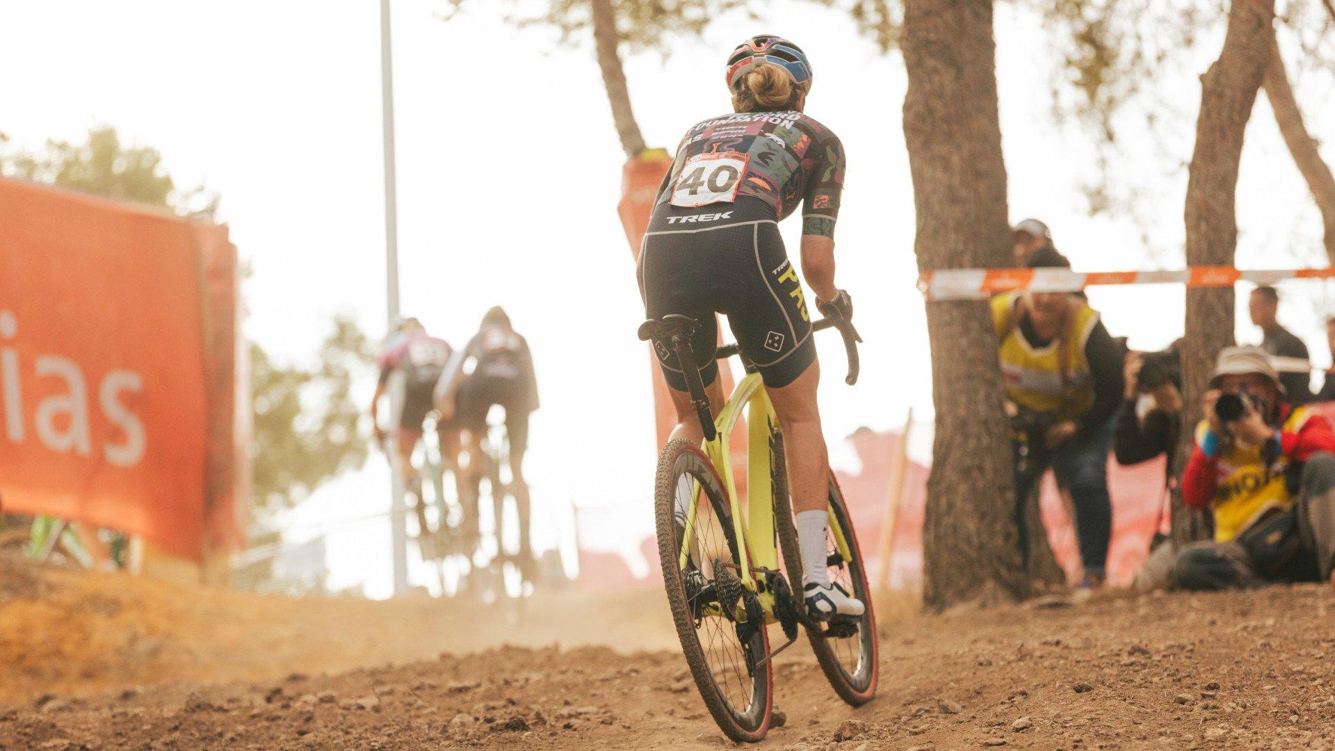 Cyclist wearing patterned jersey with race number 40 on cyclocross bike during competition