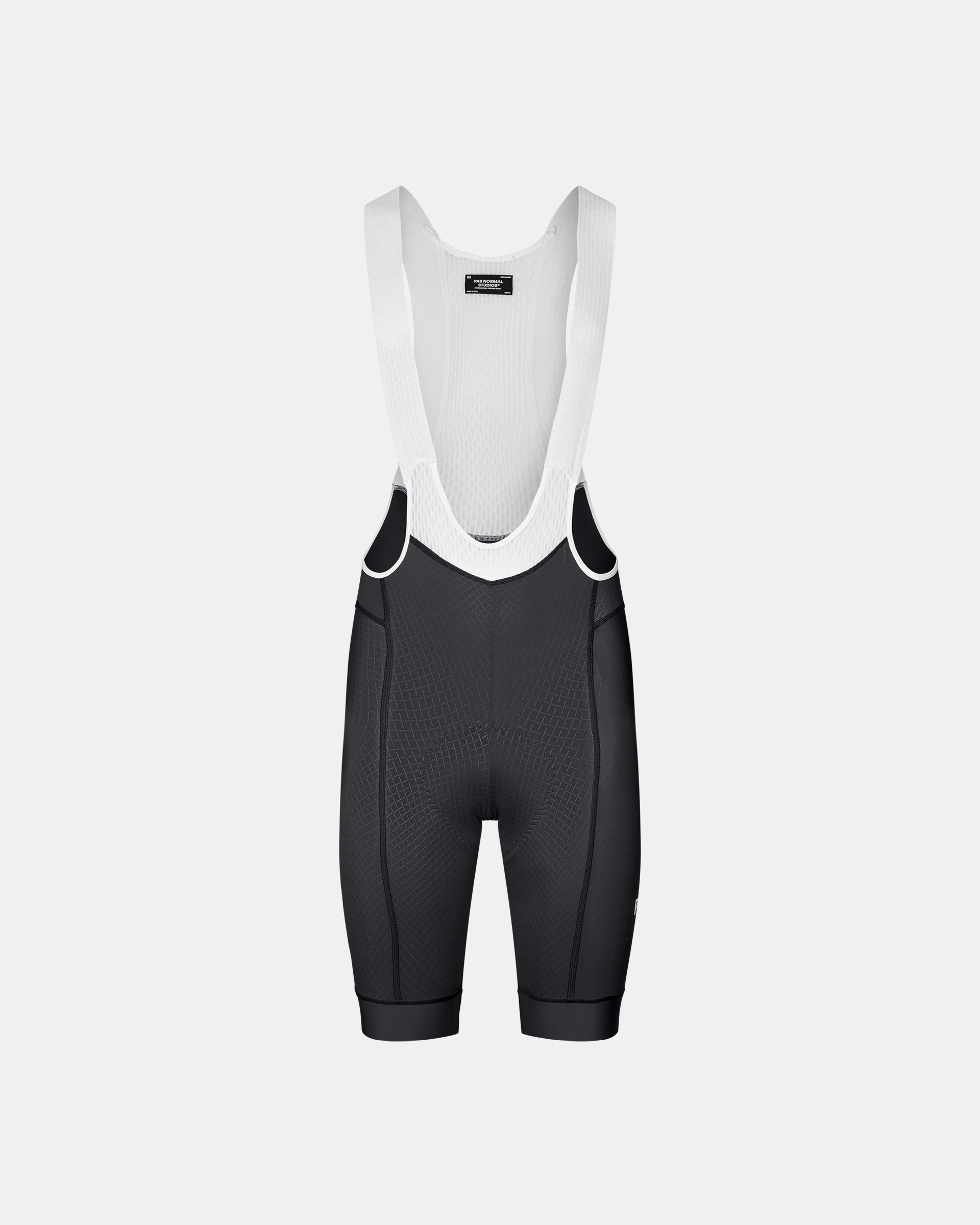 Dark Navy Mechanism cycling bibs, front flat lay with white mesh bib panel and textured front panel